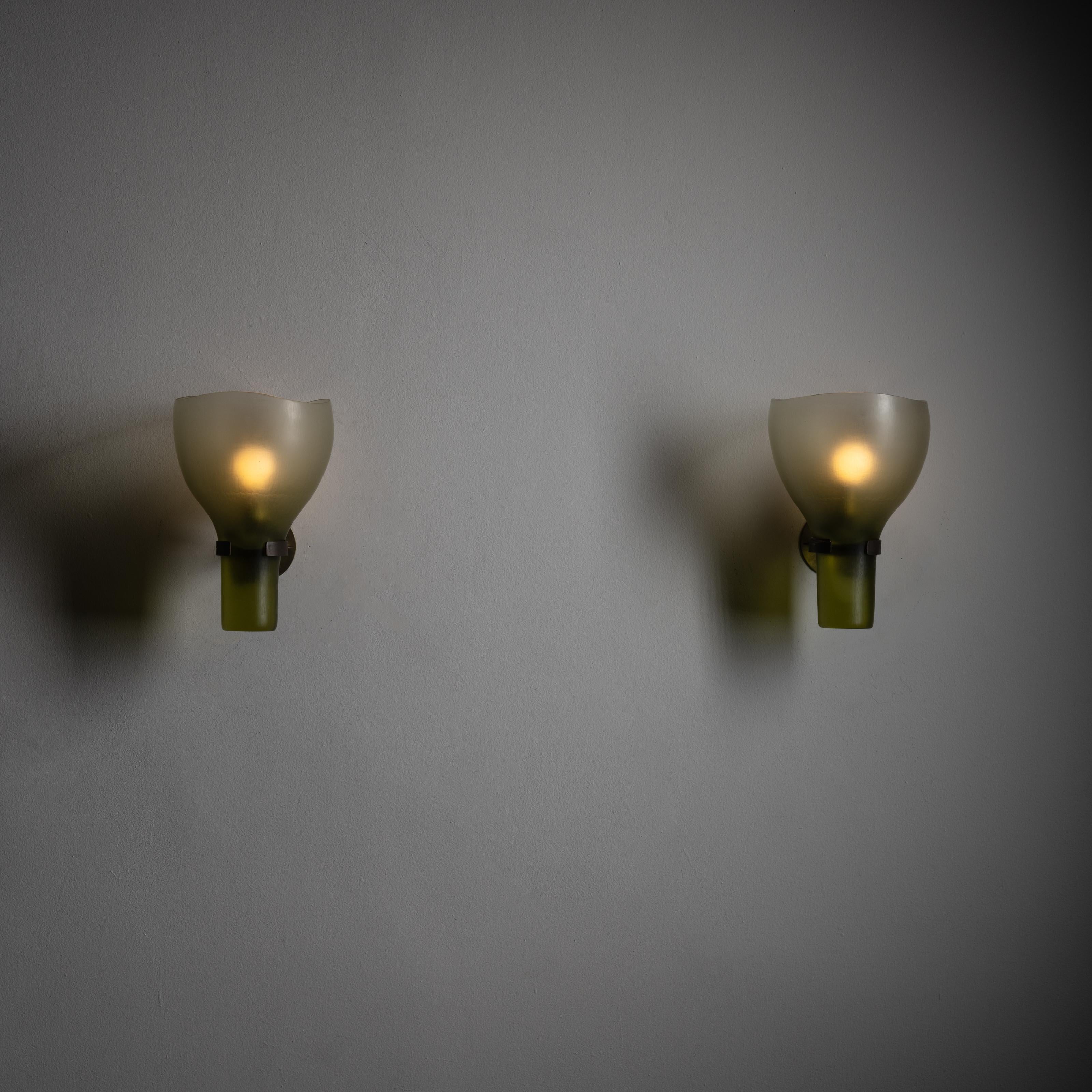 Pair of sconces by Tobia Scarpa for Venini. Rare battuto glass chalice shaped wall sconce in a soft sage color. We recommend a 40w maximum E12 bulb. Wired for US Standards. Bulbs not included.

Literature: Franco Deboni, Venini Glass: Its History,
