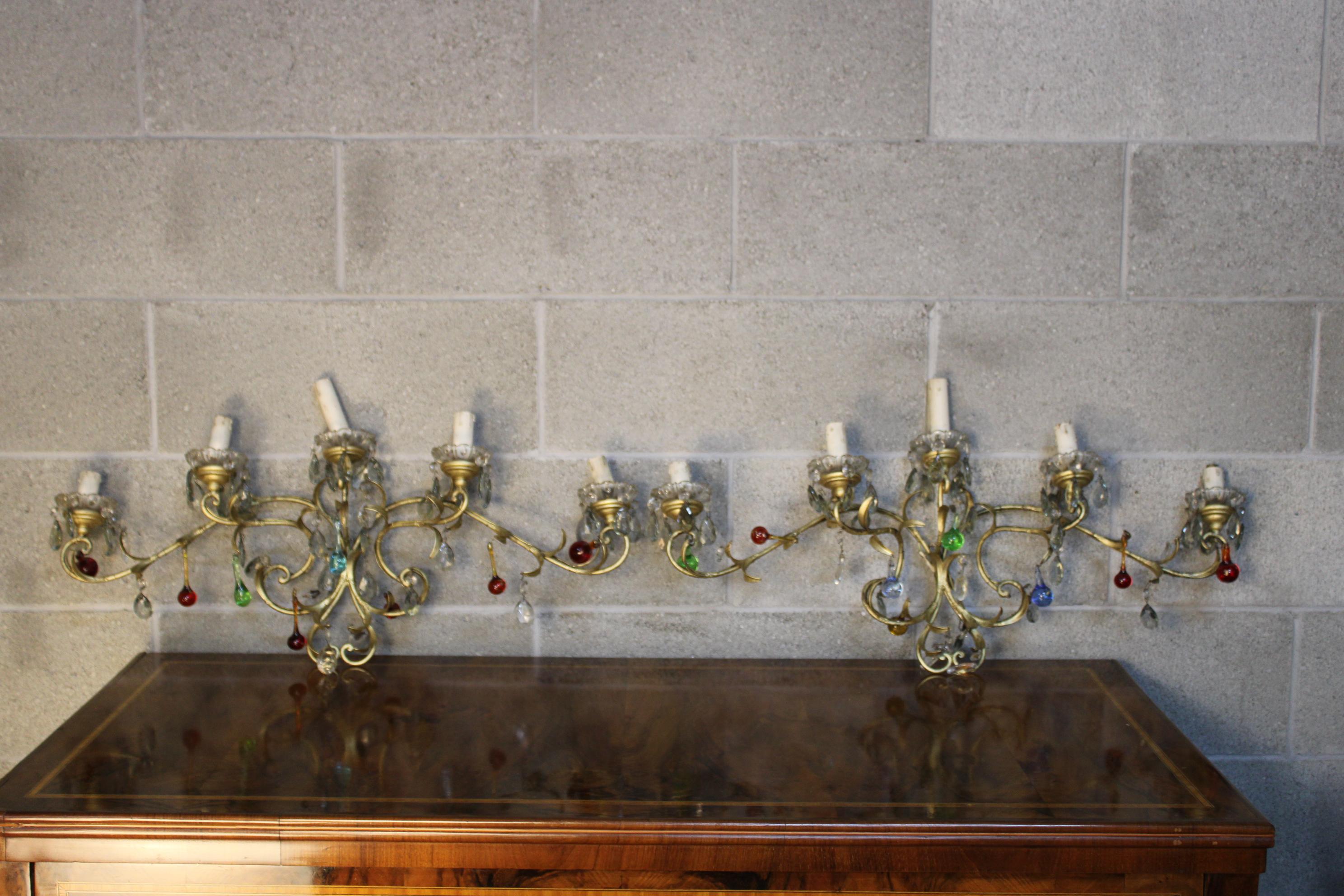 Pair of sconces, circa 1920, Italy.
Very old particular pieces.
Colorful murano glasses and gilt bronze.