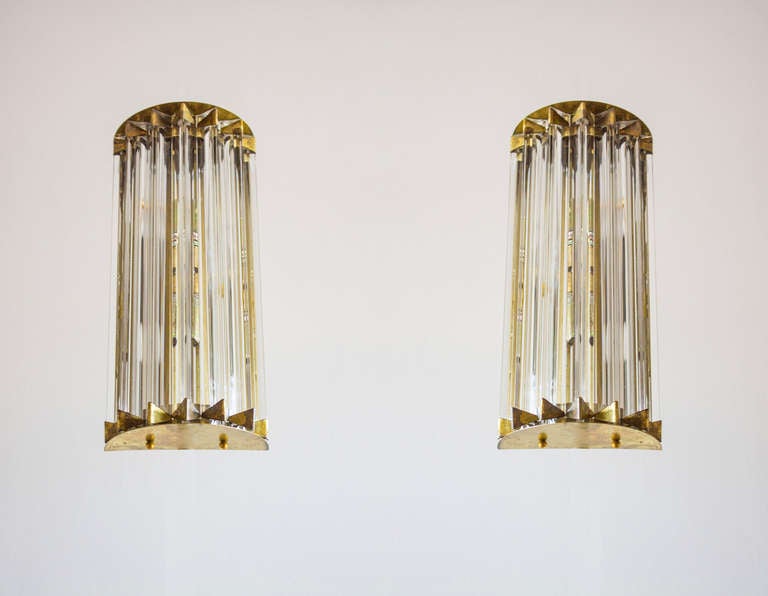 Pair of sconces clear color in brass frame shaped as a star, 1980s, Italy.
This is a masterpiece a pair of sconces in its own original brass frame, with blown Murano glass elements all allocated in a star shaped frame. They are very bright. Their