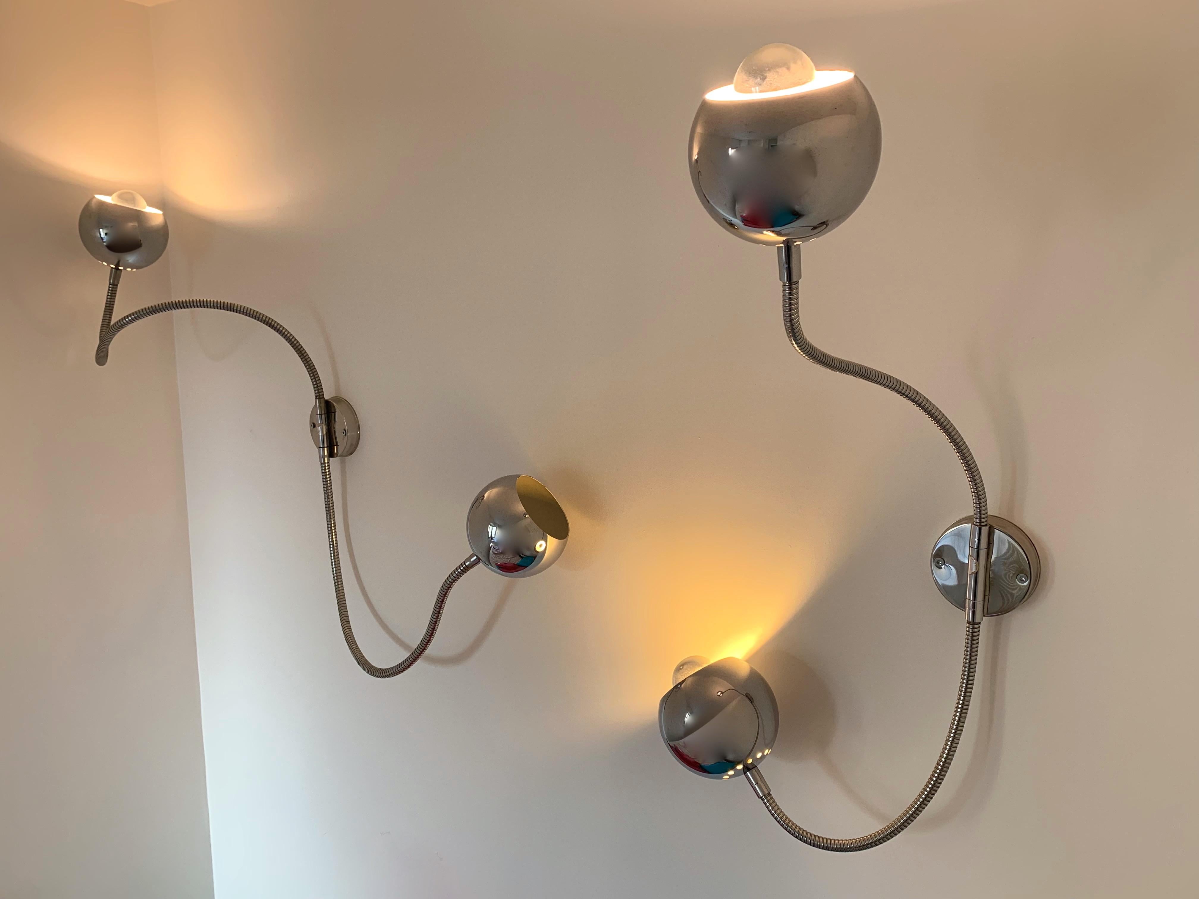 Pair of wall lights lamps sconces eyes ball articulated arms, metal chrome by Reggiani. Original stamp of the manufacture. Famous design like Sciolari, Willy Rizzo, Targetti, Lumica

To note: The arms have different longer. Each arm of each sconce