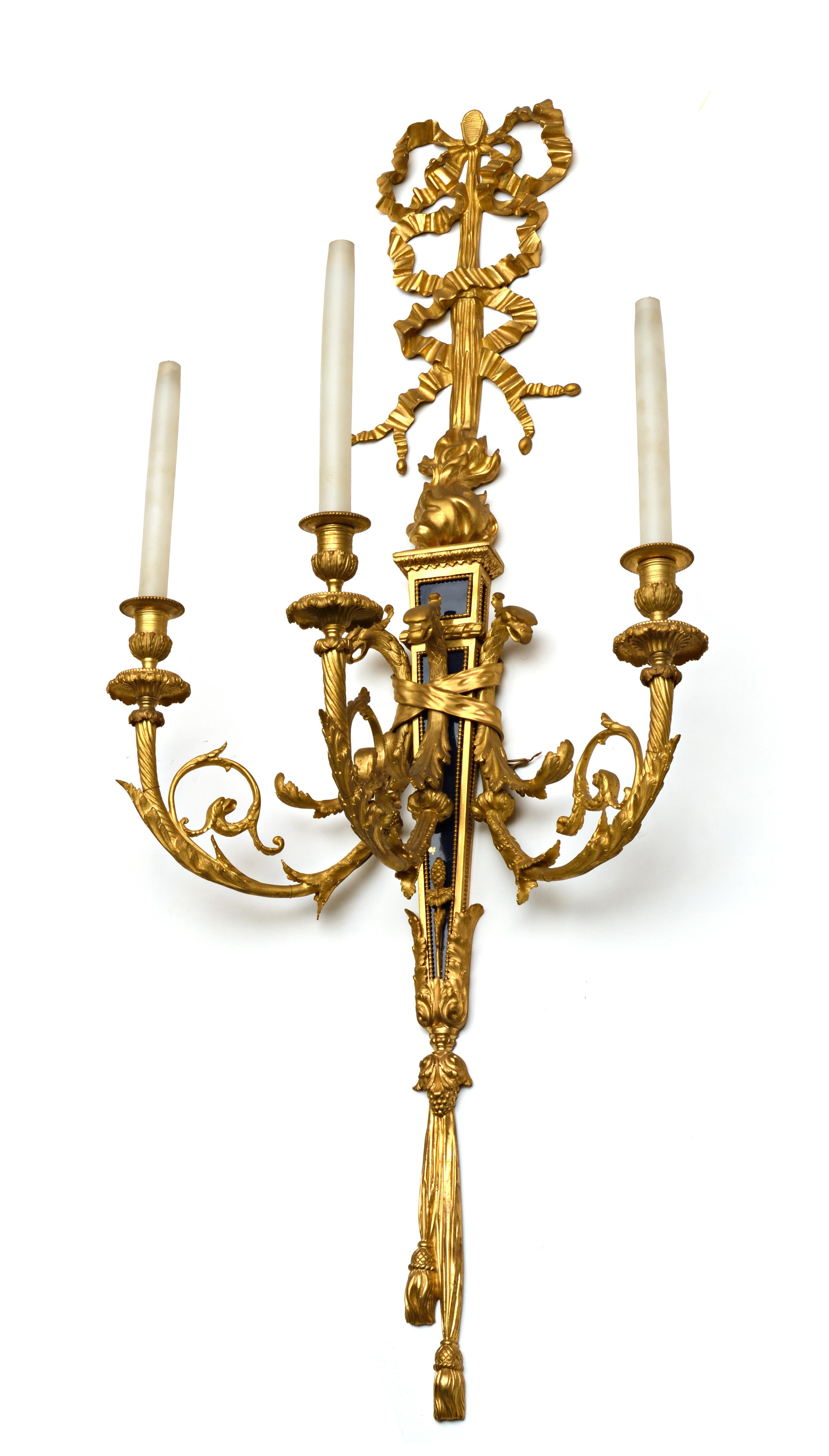 A finely cast pair of louis XVI style gilt bronze and blue steel three lights. Although
apparently unmarked. The quality of the bronze casting is of the highest Parisian 
standards of the period.