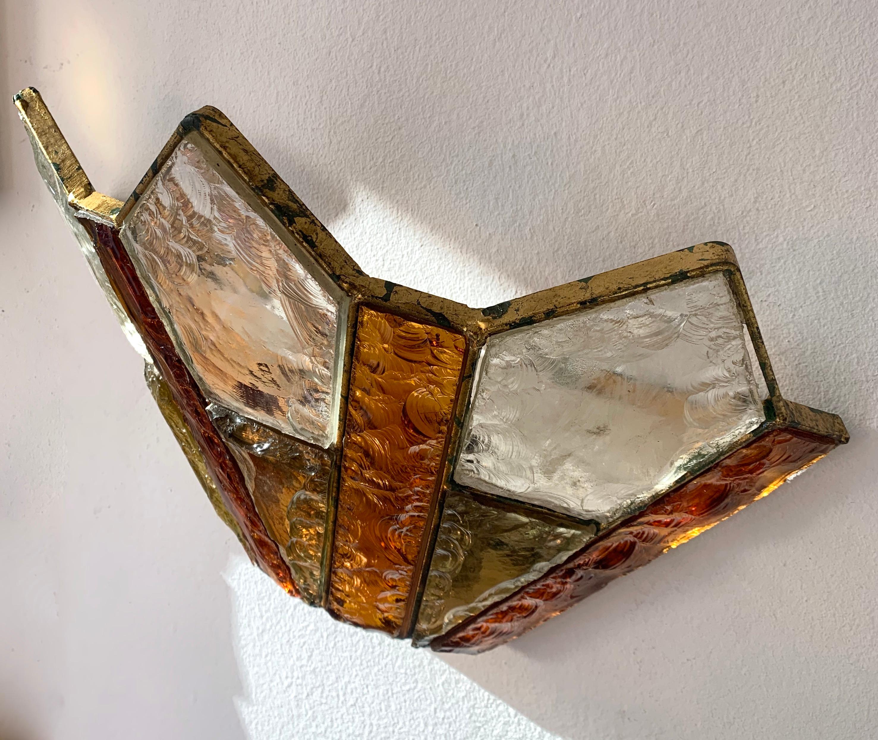 Pair of wall light lamp sconces amber, yellow and clear hammered glass, wrought iron and gold leaf with a patina work by the manufacture Longobard the concurent of Poliarte during the 1970s. Famous design like Mazzega Murano, Venini, Vistosi, La