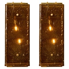 Pair of sconces in brass and amber Murano glass by Studio Glustin