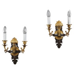 Pareja de candelabros de bronce cincelado y dorado, época Charles X
