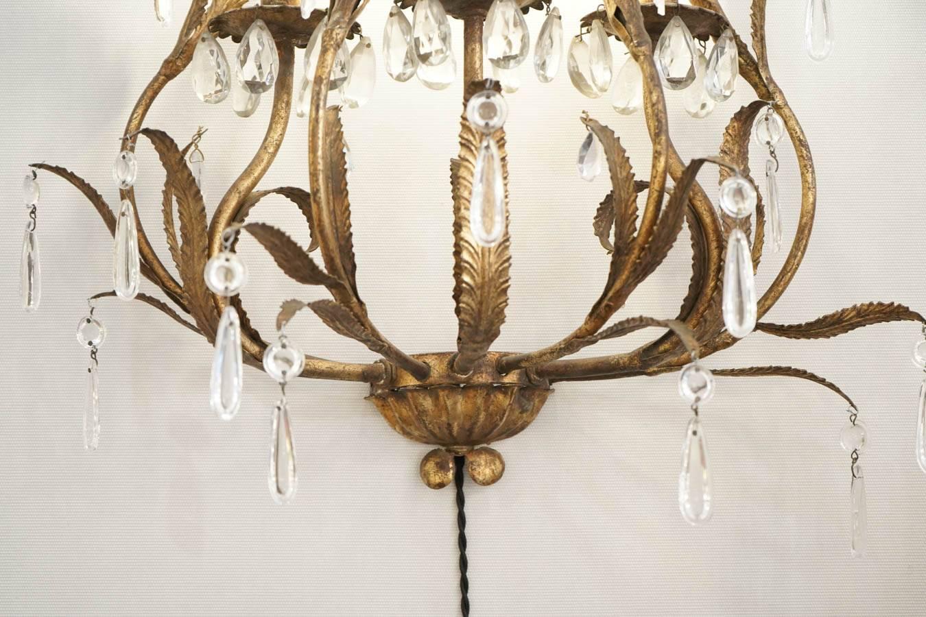 French Pair of Sconces in Gold gilt metal with crystals, 1950-1960, Three lights