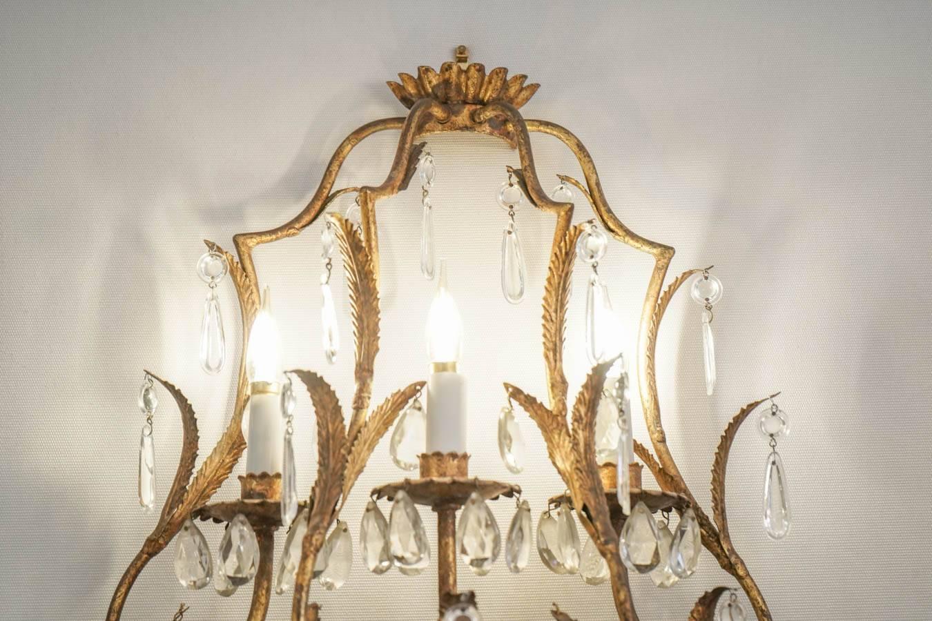 Gilt Pair of Sconces in Gold gilt metal with crystals, 1950-1960, Three lights