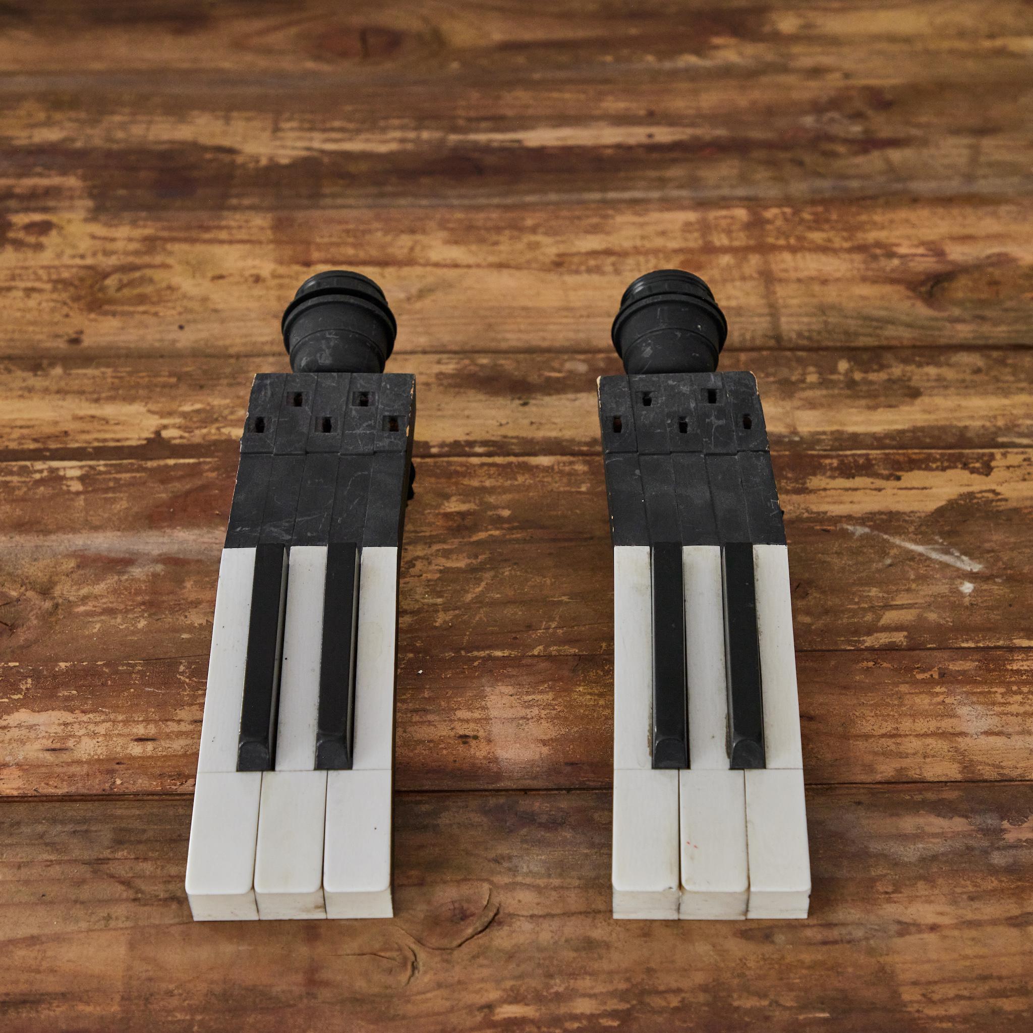 Pair of sconces made from the keys of a late 19th-century Belgian piano. Whimsical and visually striking, these are a unique way to include a musical dimension in the design of any room.
