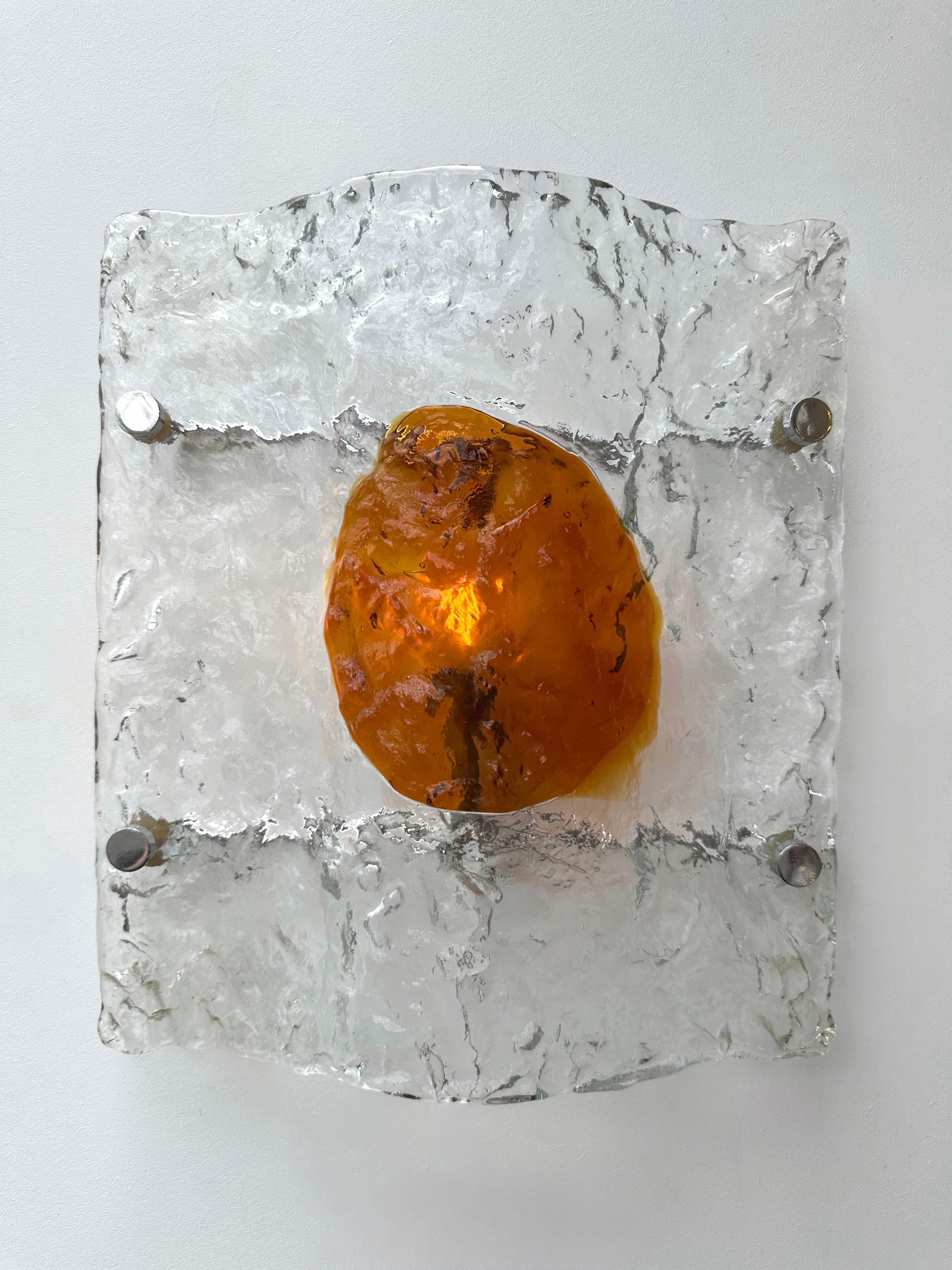 Mid-Century Modern Space Age pair of wall lights lighting lamps sconces in amber and clear textured murano glass and metal back plate by Toni Zuccheri for the manufacture Mazzega. Famous italian design like Venini, Vistosi, La Murrina, Aldo Nason,