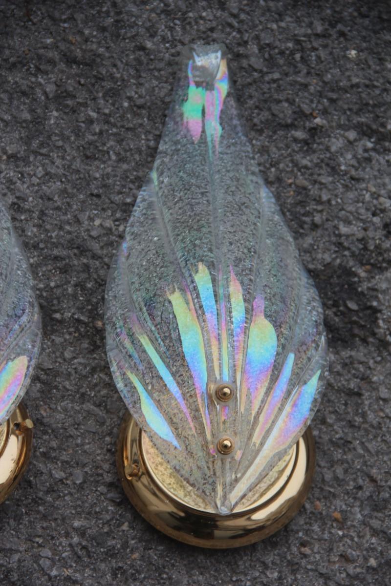 Pair of sconces Murano Iridescent glass with golden brass leaf Italian design.

Each sconce has a lamp bulb attack E27 max 80 watt.