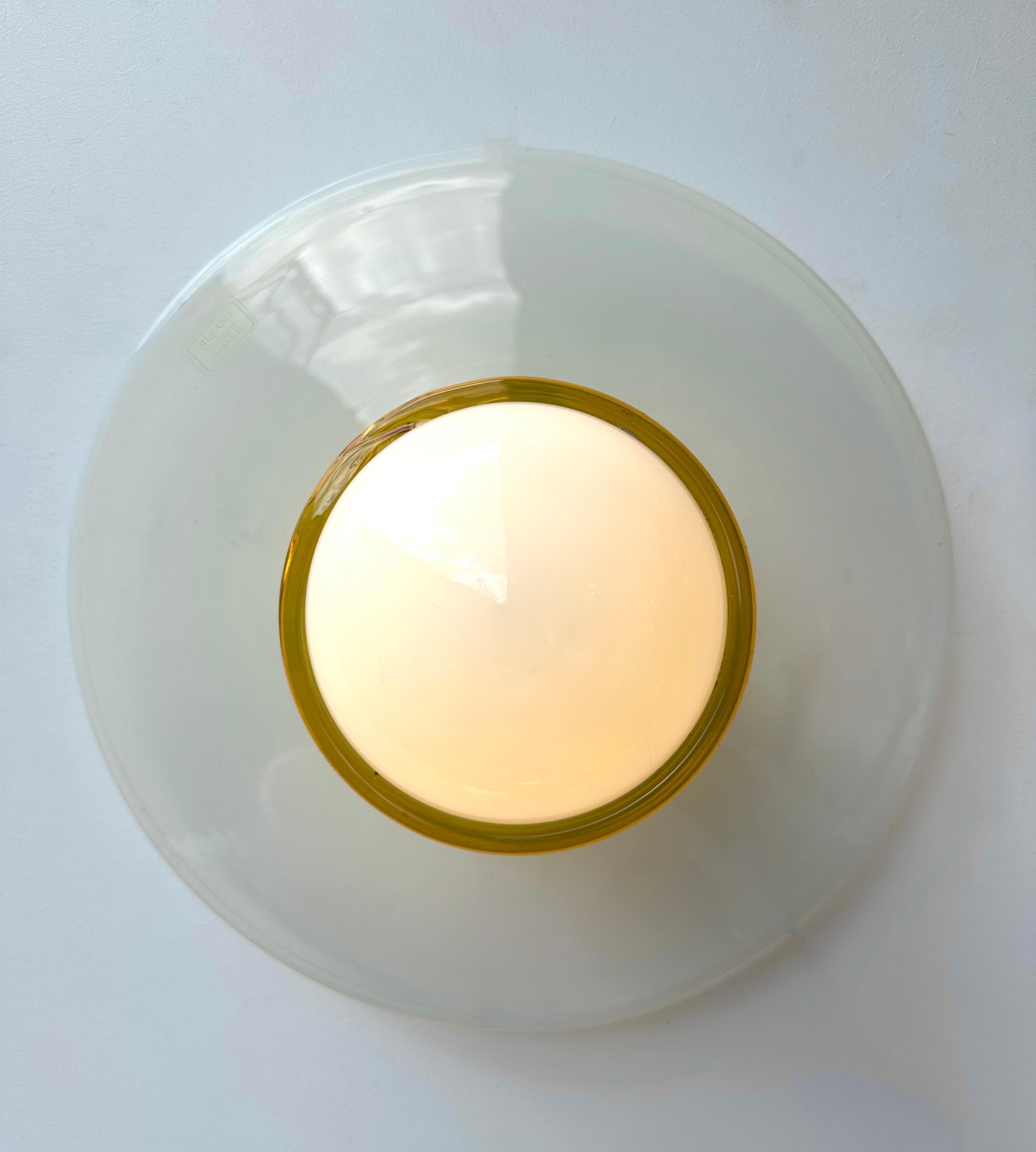 Mid-Century Modern Space Age pair of wall lights lighting lamps sconces baby blue opalescent murano glass disc by the italian design manufacture ITRE. Original murano glass garantee tag. Famous italian design like Venini, Vistosi, La Murrina, Aldo
