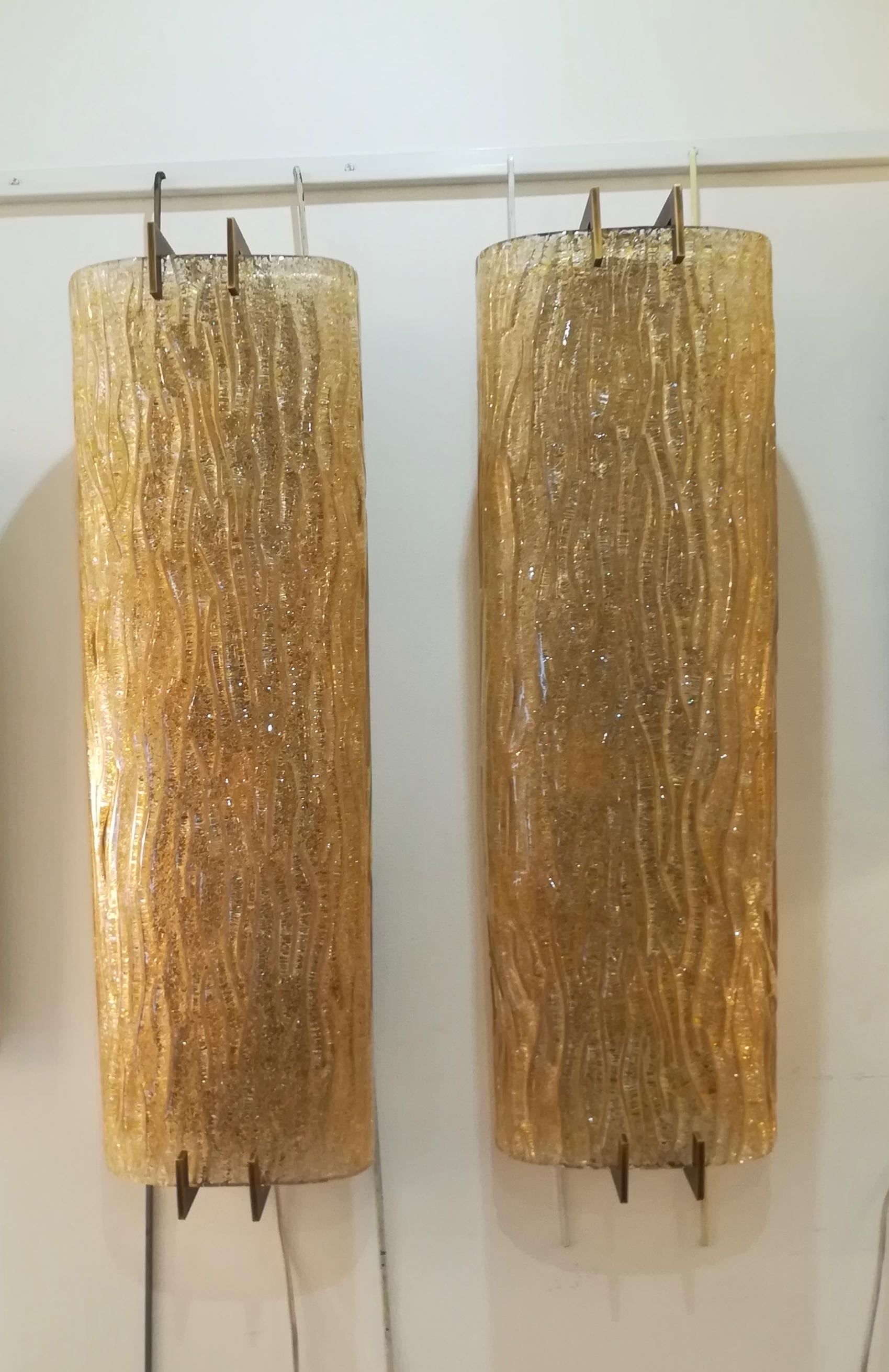 Pair of sconces thick glass and patinated brass.
Four bulbs per unit.
In excellent condition.