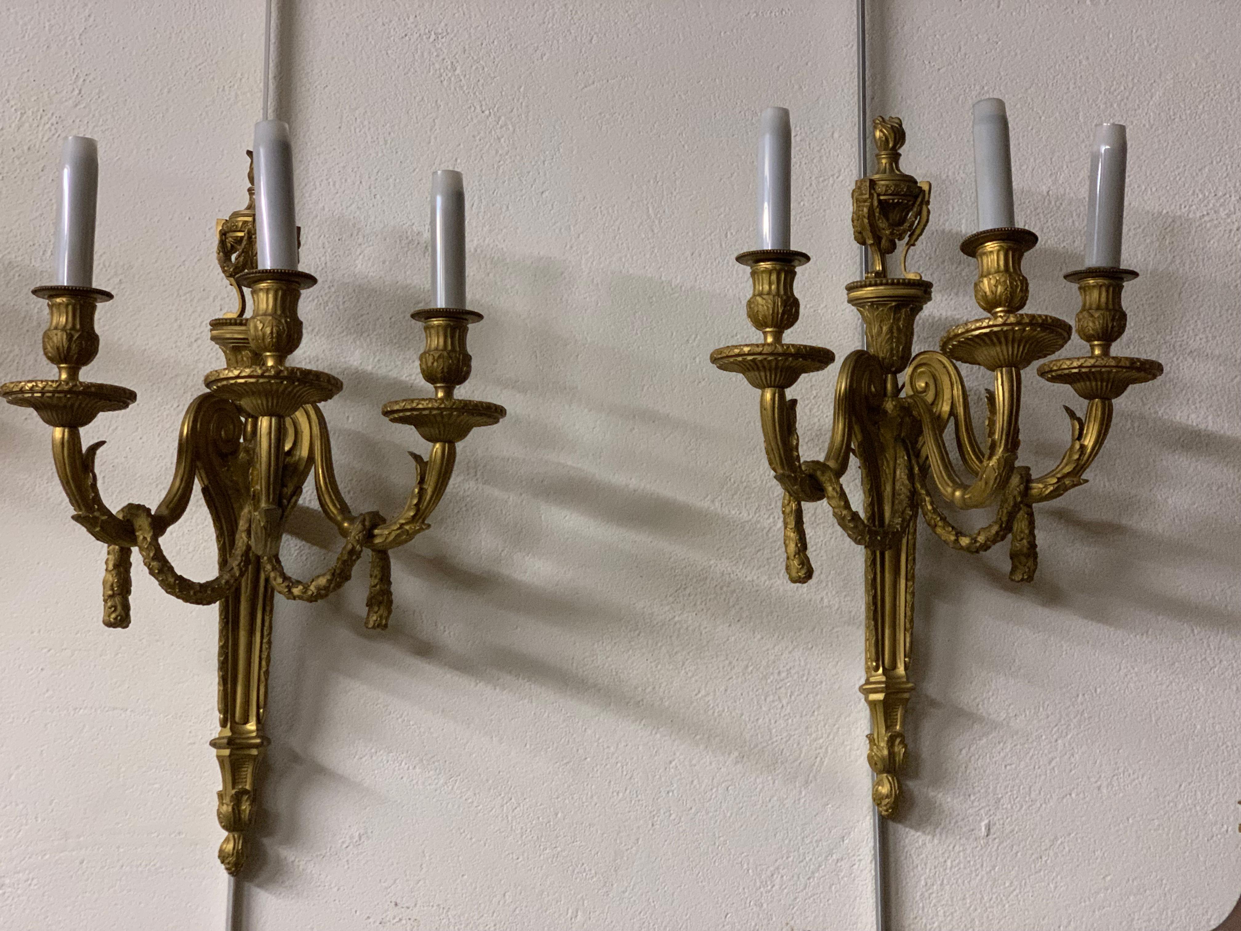 Whismical pair of sconces gilt bronze three lights ,louis XVI style after a famous model executed by Delafosse one of the best bronzier of his time 
this  pair is finely executed 