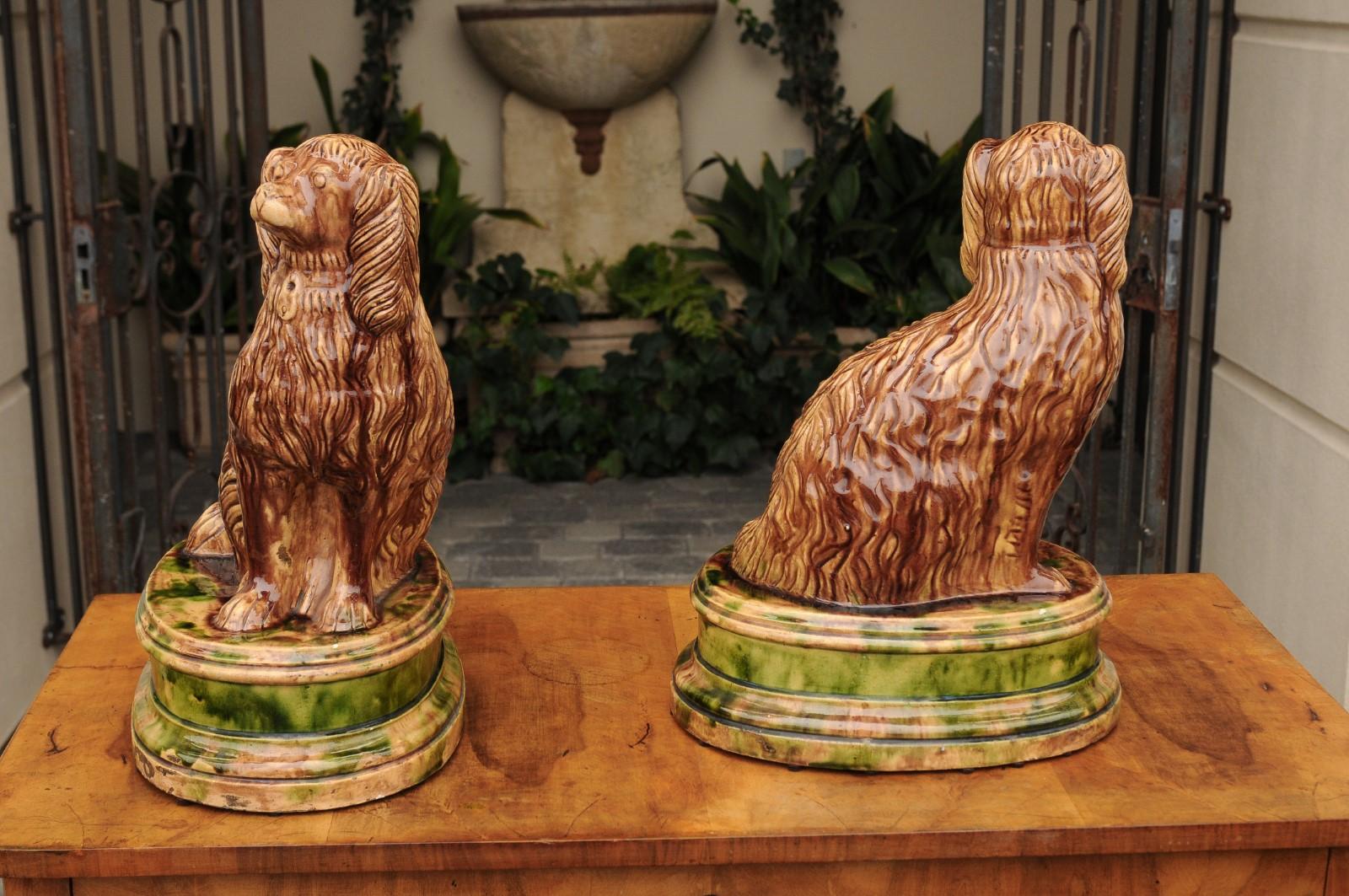 Victorian Pair of Scottish 1880s Brown Glazed Pottery Dog Sculptures Raised on Oval Bases