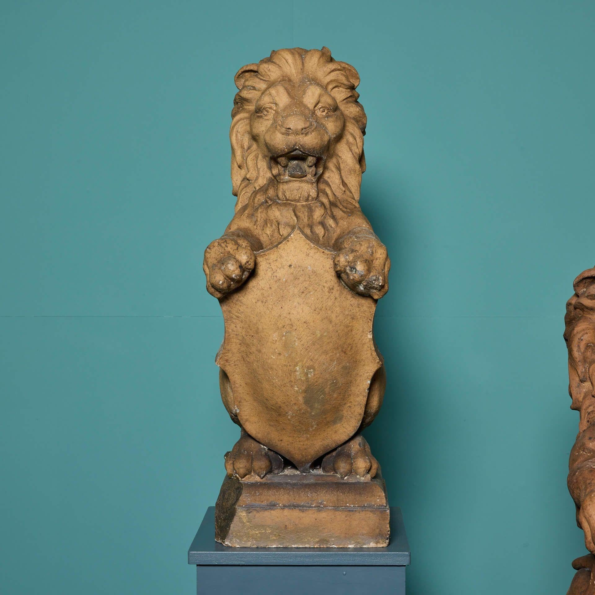 Pair of Scottish Terracotta Shield-bearing Lion Finials In Fair Condition For Sale In Wormelow, Herefordshire