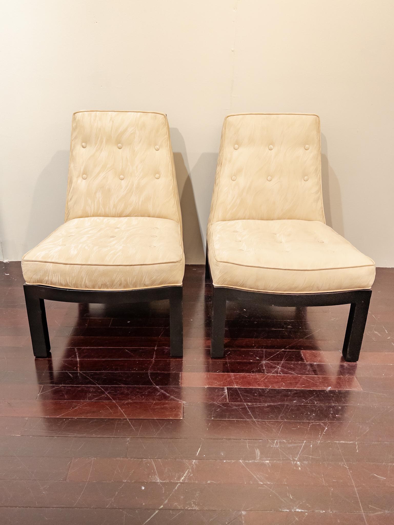 This pair of Screen Back Slipper Chairs, reminiscent of the iconic designs by Edward Wormley and James Mont, embodies a perfect fusion of sophistication and functionality. Crafted from ebonized mahogany, they exude a timeless allure with their sleek