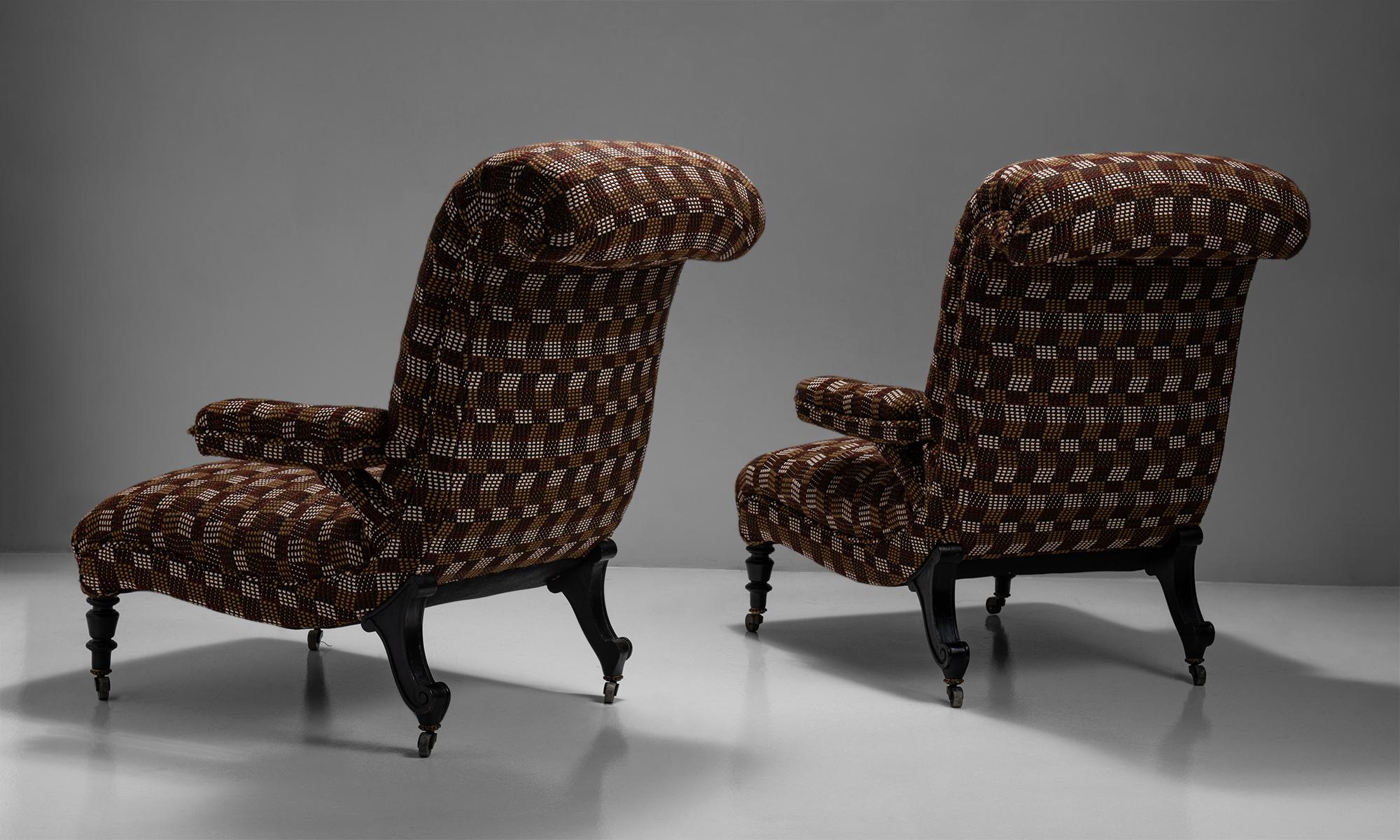 Pair of scroll back armchairs in wool blend from Pierre Frey

France, Circa 1890

Handsome pair of armchairs with ebonised walnut legs and original castors.
