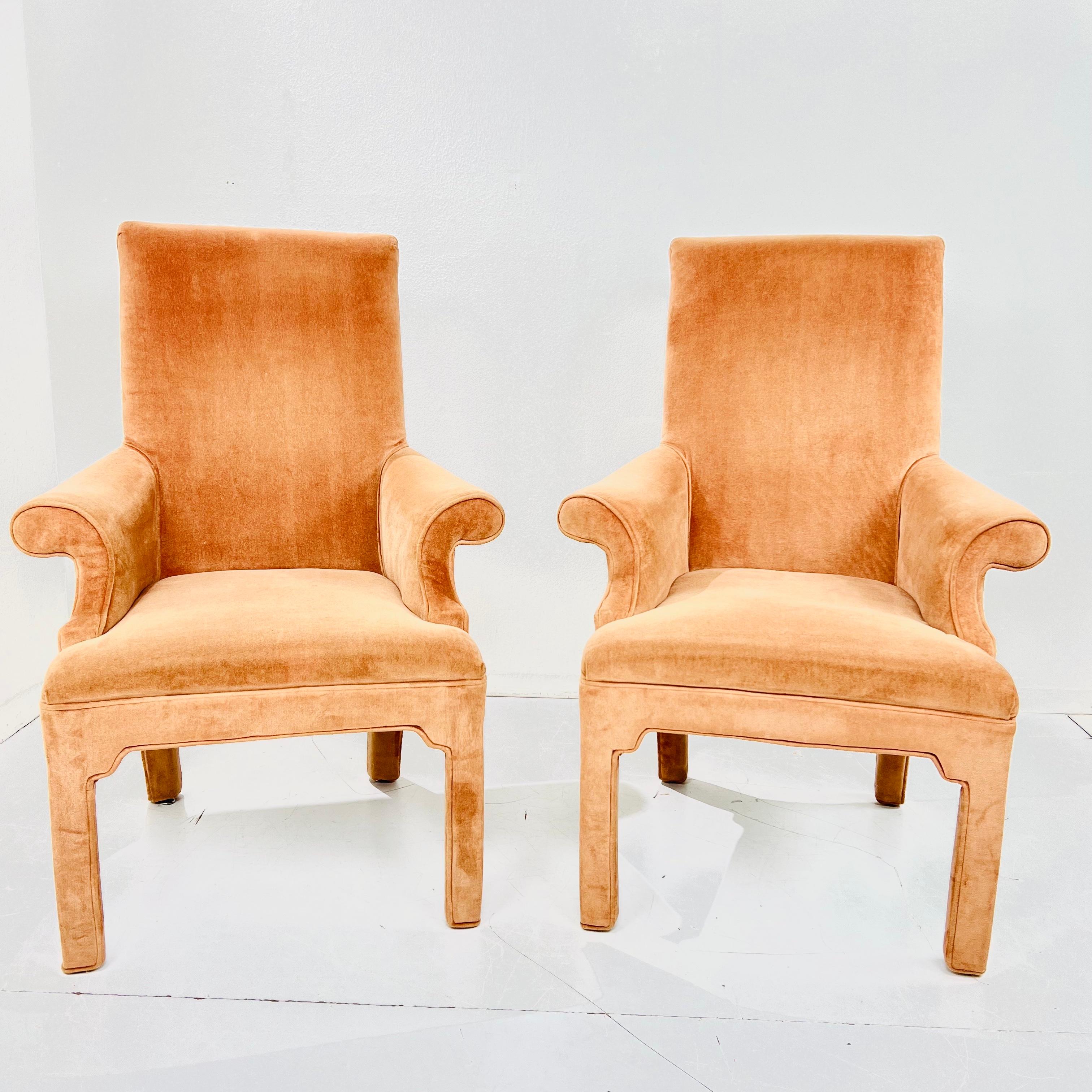 Sophisticated pair of postmodern armchairs in the style of Milo Baughman. Scrolled rollback design adds elegance, flair and movement to the simple parsons lines. 
Stool seats are padded and comfortable. Good structural condition with some minor