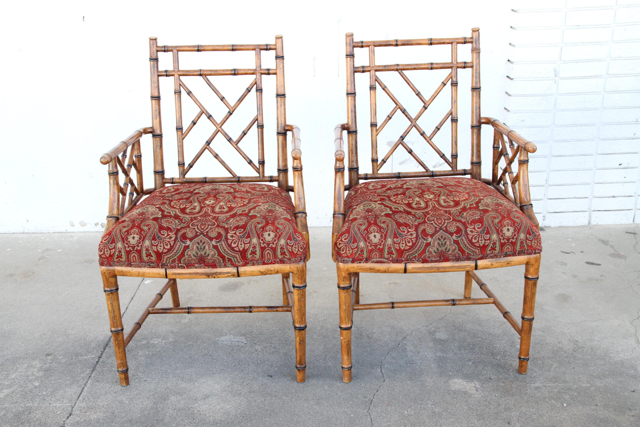 A very fine pair of Chippendale Style Faux Bamboo Armchairs acquired from premier design house Scully & Scully. With excellent form including tapering front legs, cross stretcher and fine proportions, the Pair are in a medium red cushion. The custom