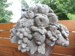 Pair of Sculpted Italian Limestone Fruit Baskets on Tall Tapered Plinths