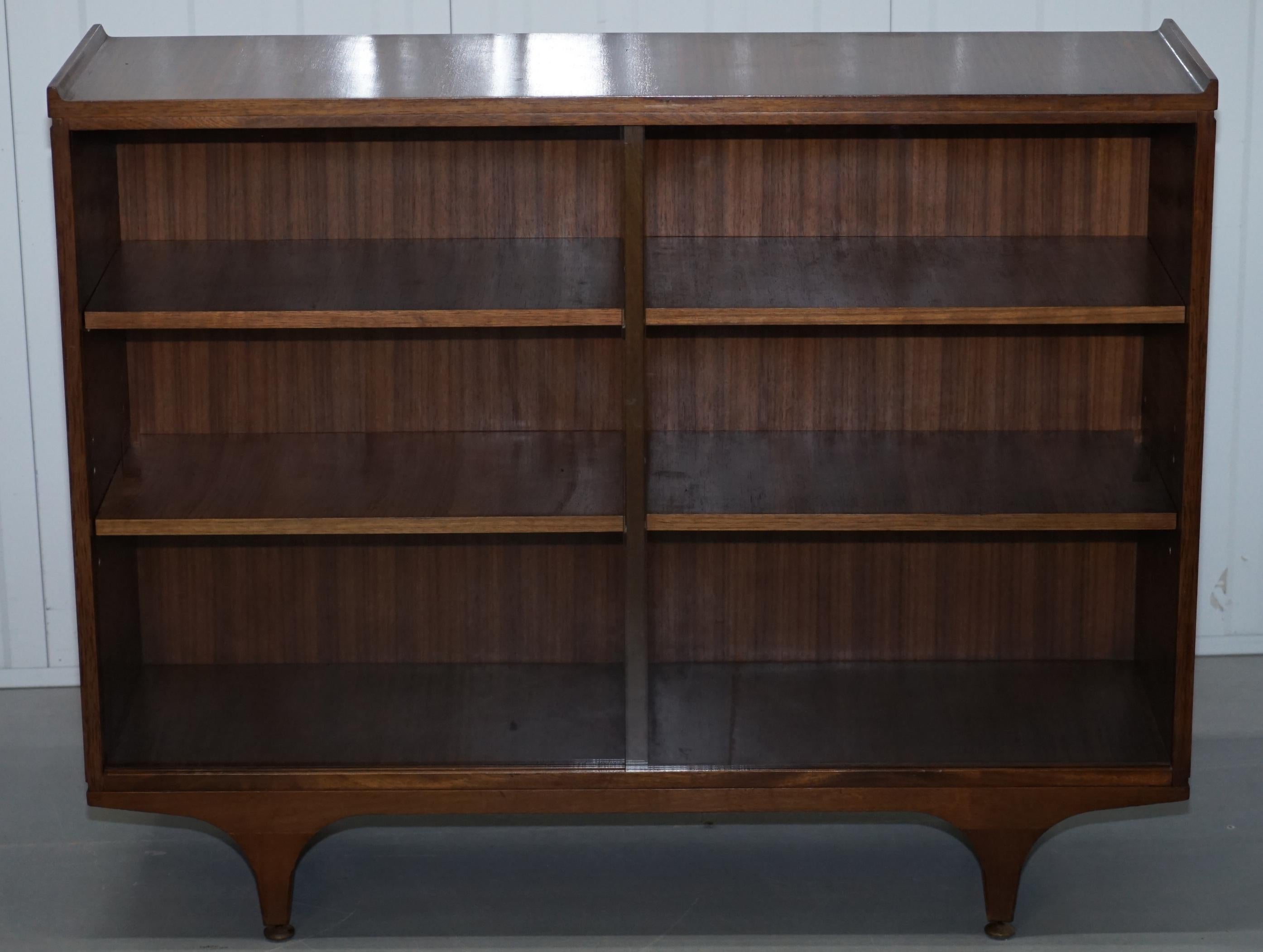 British Pair of Sculpted Mid-Century Modern Teak Bookcases with Glass Sliding Doors