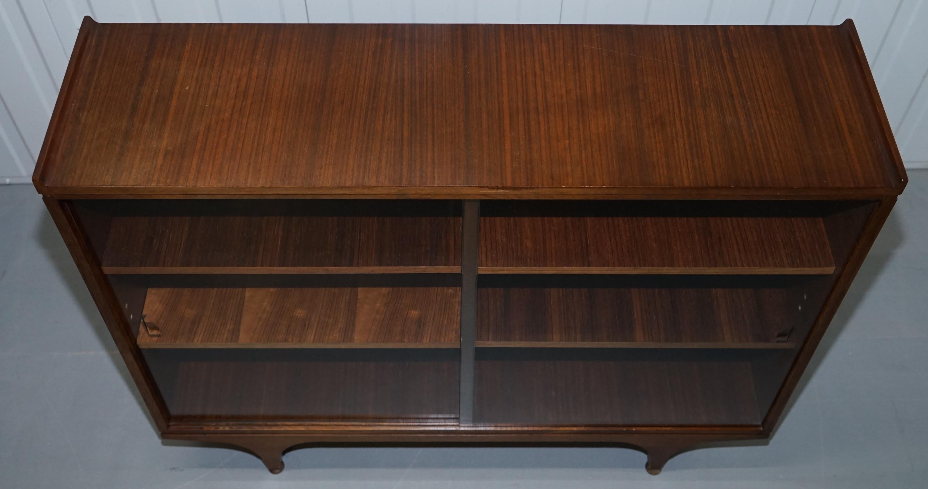 Hand-Crafted Pair of Sculpted Mid-Century Modern Teak Bookcases with Glass Sliding Doors