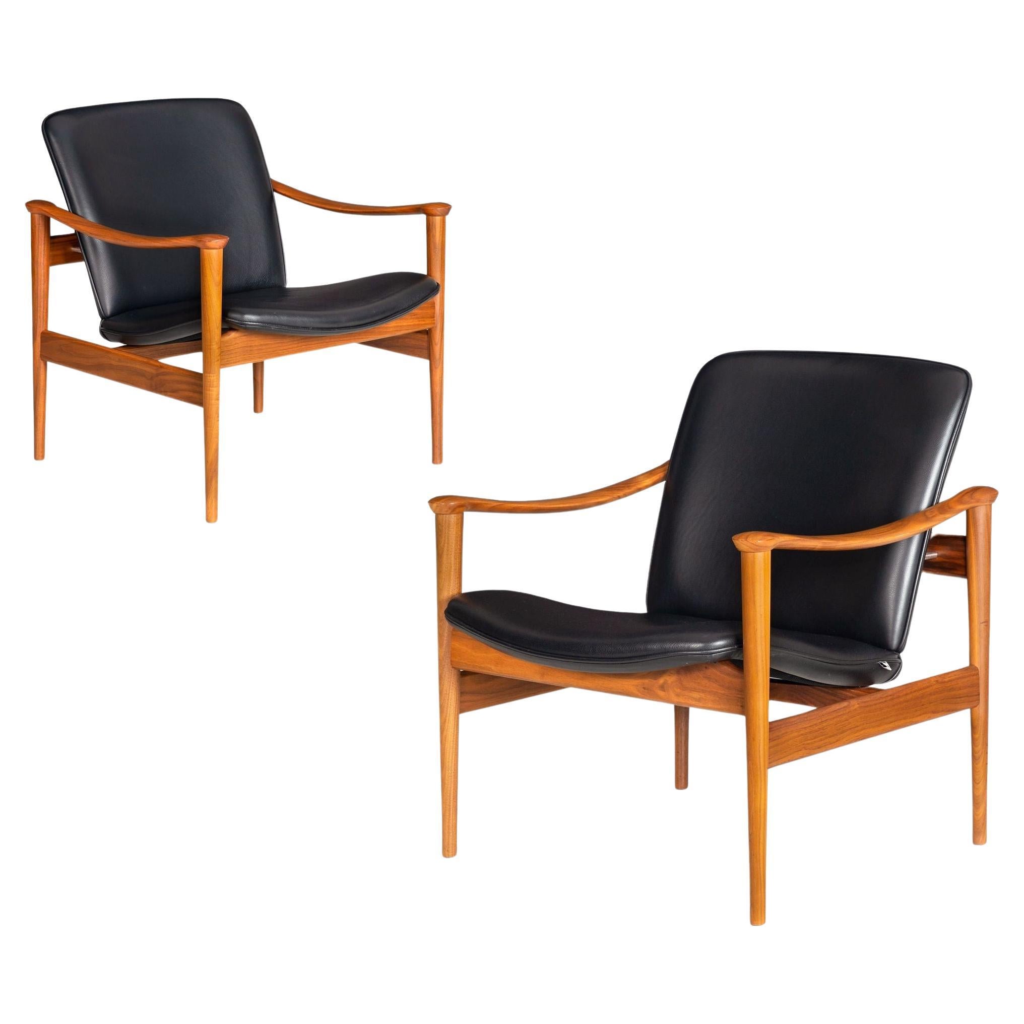 Pair of Sculpted Walnut no. 711 Lounge Arm Chairs by Frederik Kayser For Sale