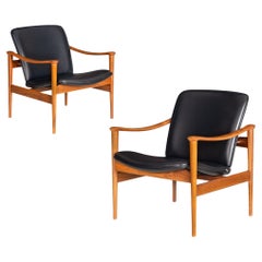 Pair of Sculpted Walnut no. 711 Lounge Arm Chairs by Frederik Kayser