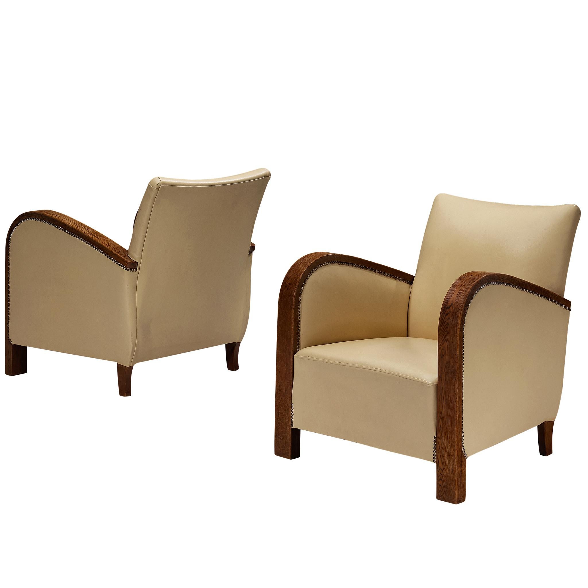 Pair of Sculptural Art Deco Armchairs with Brass Detailing