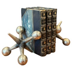 Pair of Sculptural Brass Jack / Jax Bookends in the Style of Bill Curry