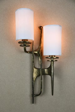 Pair of sculptural brutalist bronze wall sconces attributed to Félix Agostini, F