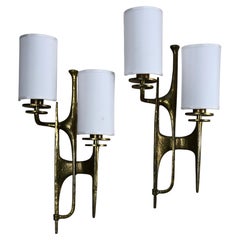 Pair of sculptural brutalist bronze wall sconces attributed to Félix Agostini, F