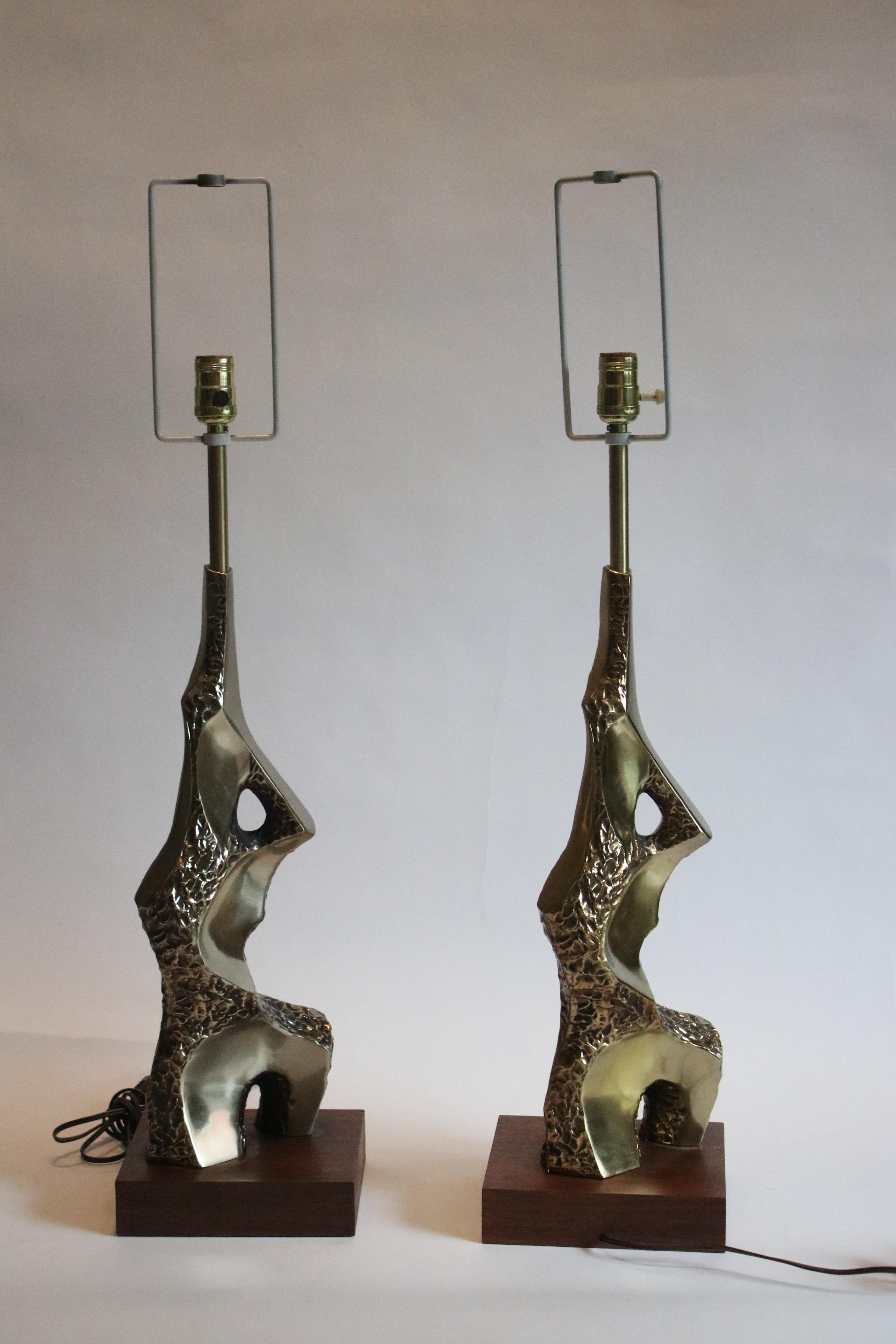 Pair of sculptural torso lamps from the Brutalist period by Laurel Lamp Co., 1960s. Often mistakenly attributed to Maurizio Tempestini, these table lamps are all original brass metal on walnut plinths. Measurement from bottom of the base to the top