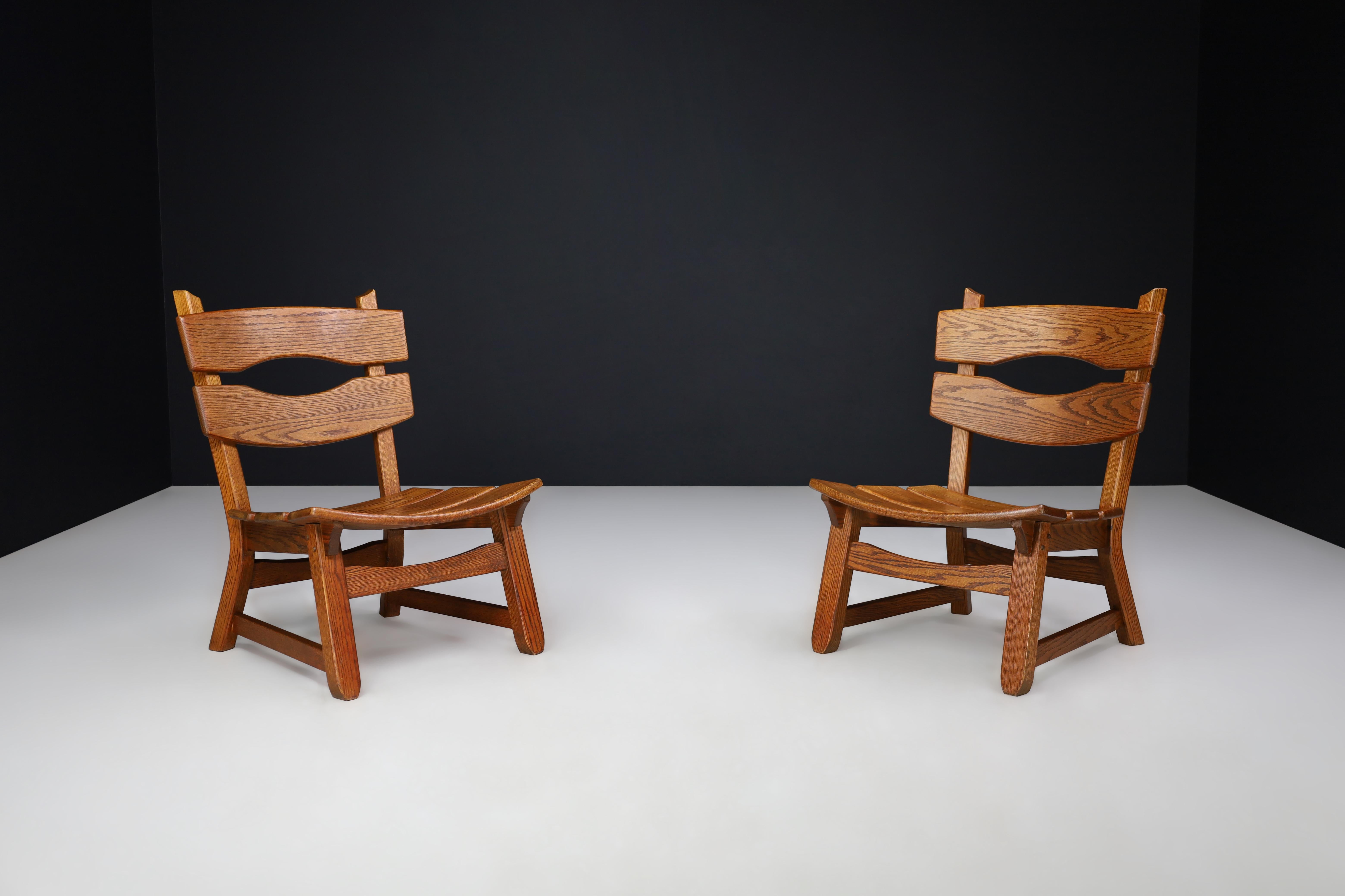 French Pair of Sculptural Brutalist Oak Lounge Chairs, France, 1960s For Sale
