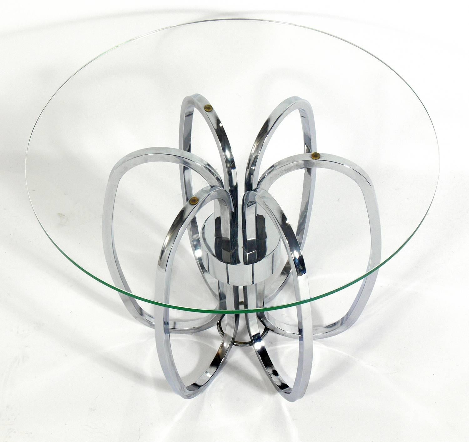 Pair of sculptural chrome-plated metal side tables, in the manner of Milo Baughman, American, circa 1960s. They are a versatile size and can be used as end or side tables, or as nightstands.