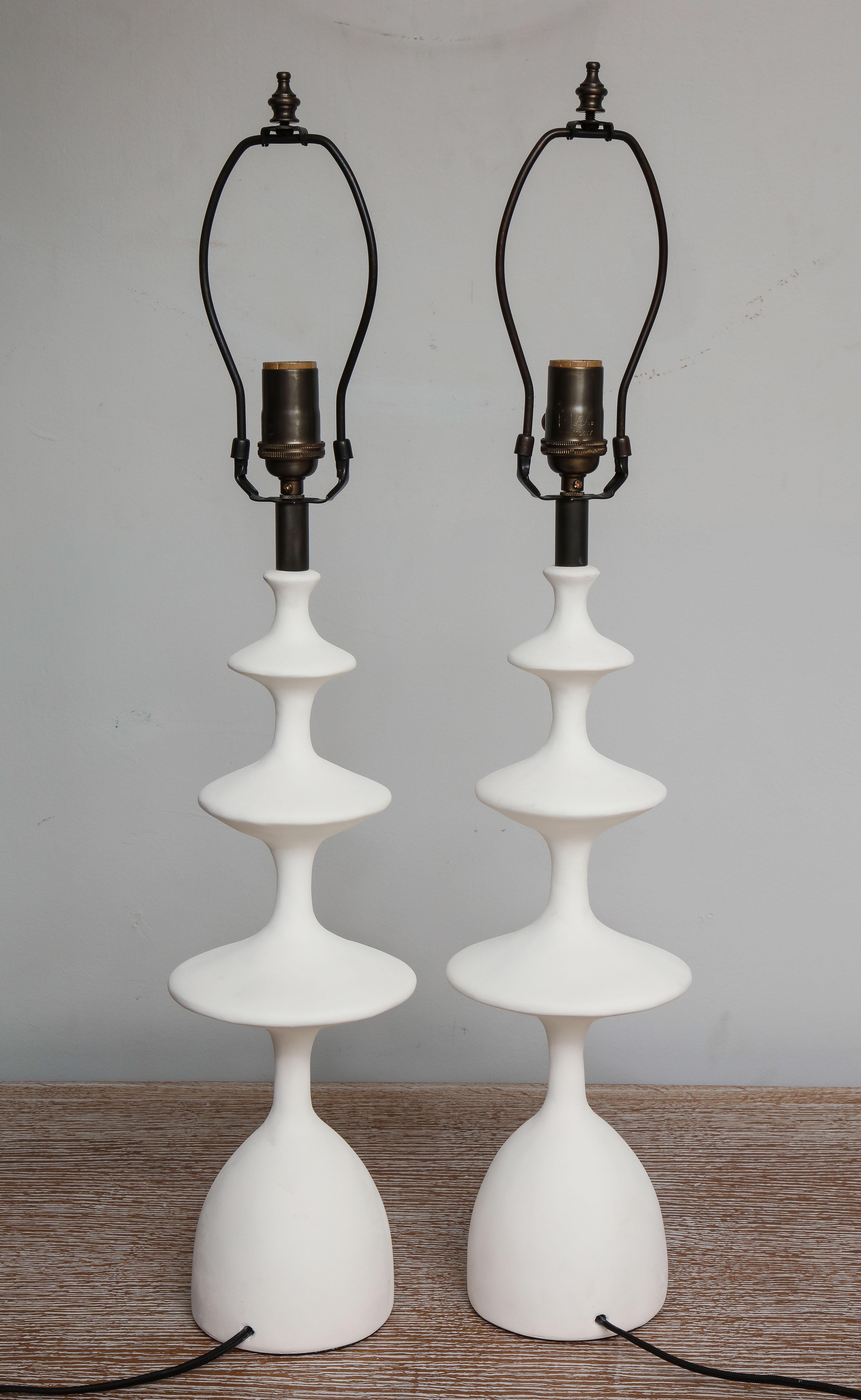 Pair of sculptural custom plaster table lamps. Priced at set of 2.
The lamp shades are not included.
Please note that these lamps are customizable.
The lead time is between 8-10  weeks.