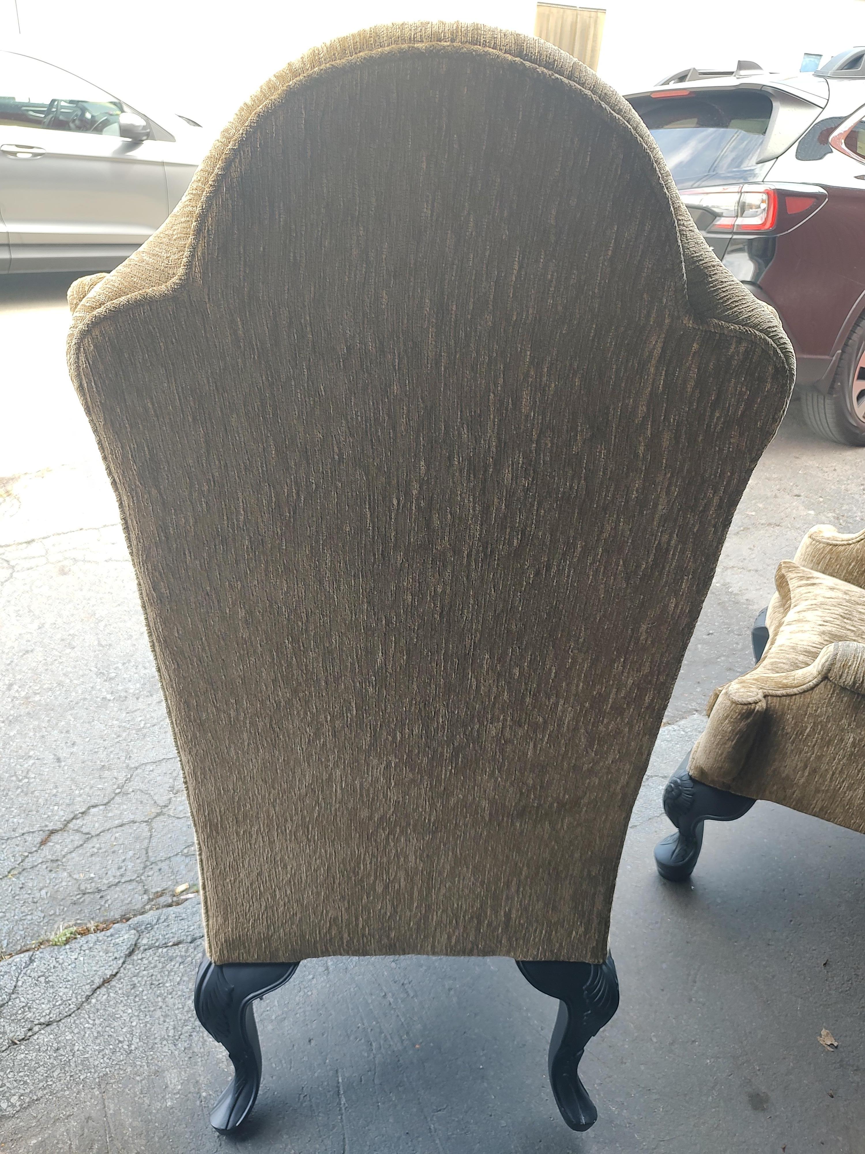 Fabulous and dramatic pair of sculptural wing chairs in the Chippendale style. Large and comfy with prominent wings. Upholstery is in good condition with some wear on the arms. Structurally sound chairs. Substantial. Lift off seat cushion. Legs were