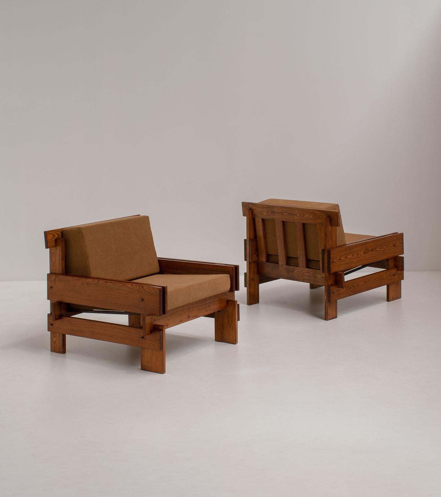 1970s Pair of French Lounge Chairs in Red Elm with Sculptural Architectural Design, Sourced from Southern France.

The wooden frame steals the show. These armchairs are the perfect eye-catcher in any room and they rarely get more interesting than