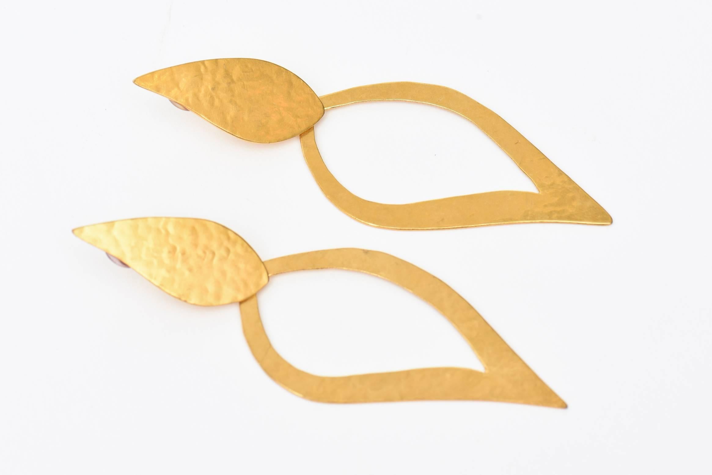 These stunning and sculptural pair of gold plated clip on teardrop shape long  dangle earrings are by the noted and collectable Herve Van Der Straeten; a French artist.
They are a beautiful shape and beautiful on. Great for day or evening and very