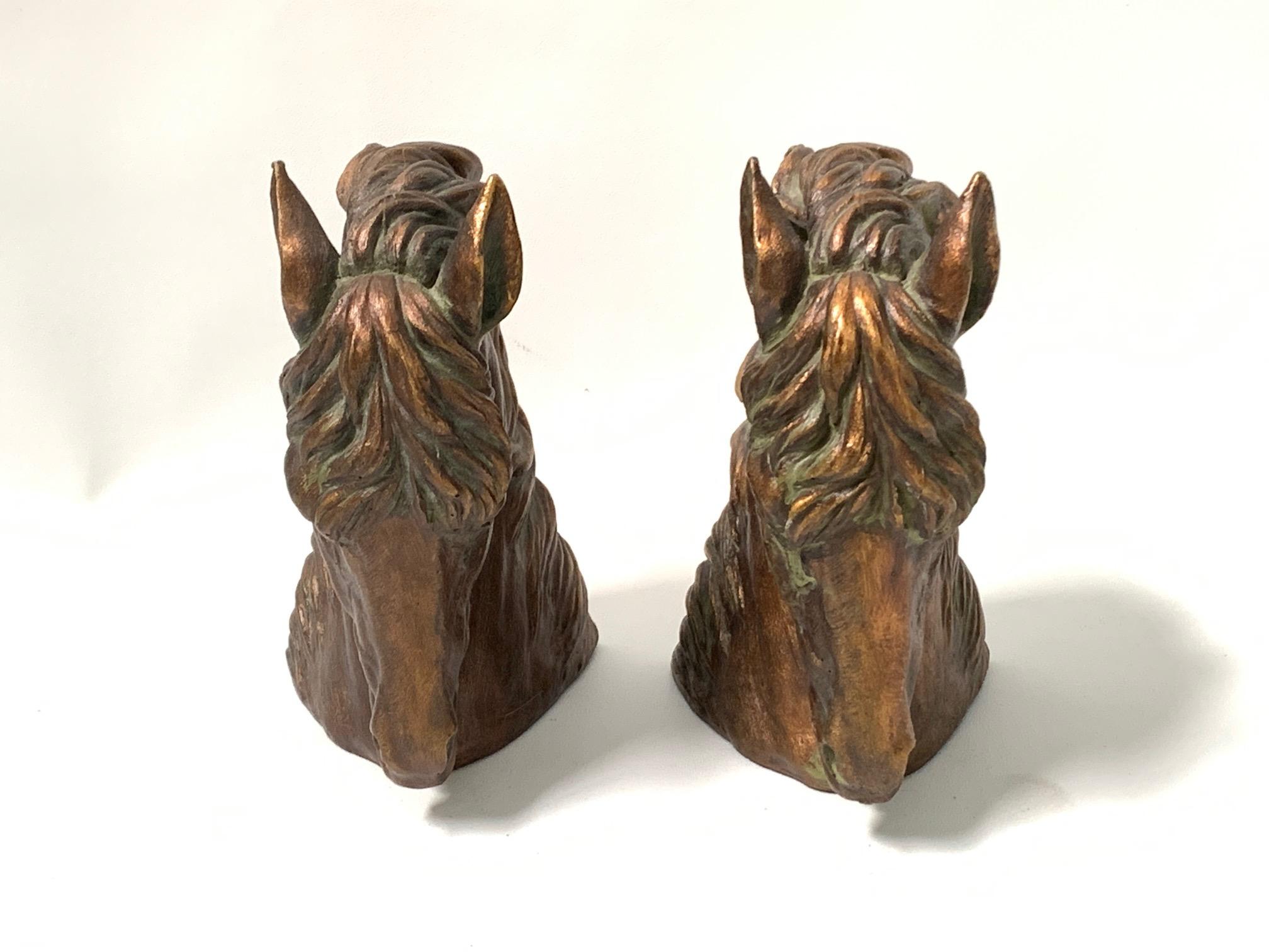 Pair of bronze midcentury bookends sculpted in the form of Majestic horse heads. Great vintage condition.
