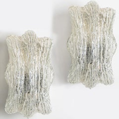Coppia di applique scultoree in vetro ghiaccio e cromo di Doria, 1970