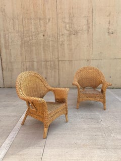 Paar skulpturale große Korbstühle aus Rattan, 20. Jahrhundert