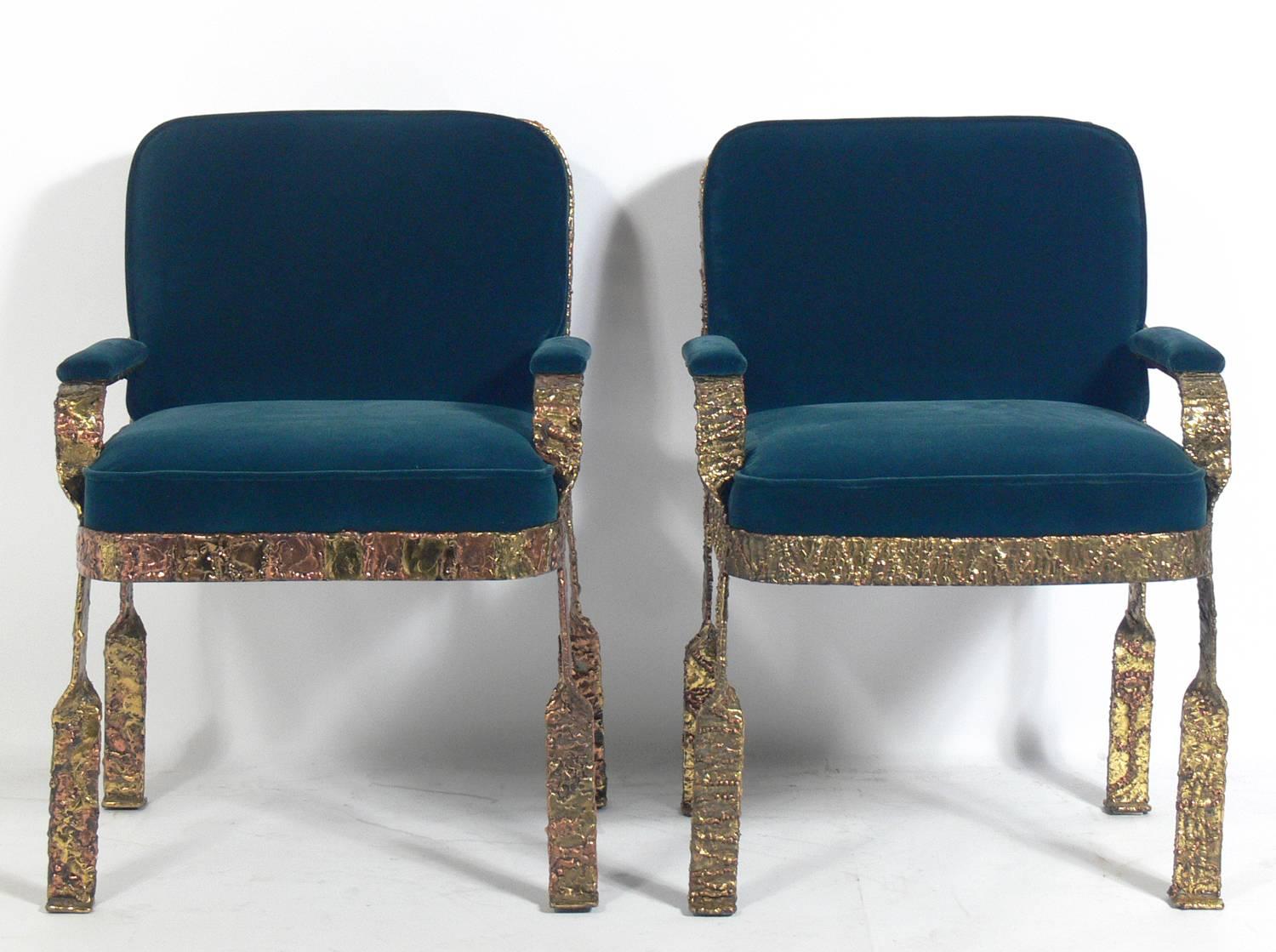 Pair of sculptural lounge chairs, attributed to Silas Seandel, American, circa 1960s. They have been reupholstered in a peacock green velvety fabric. They are very heavy and well made, and are believed to be executed in iron finished in bronze,