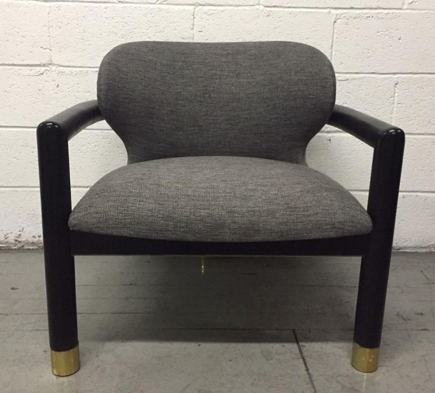 Pair of sculptural lounge chairs. Has brass sabots. Chairs are newly upholstered in gray wood-blend with a black painted wood frame.
  