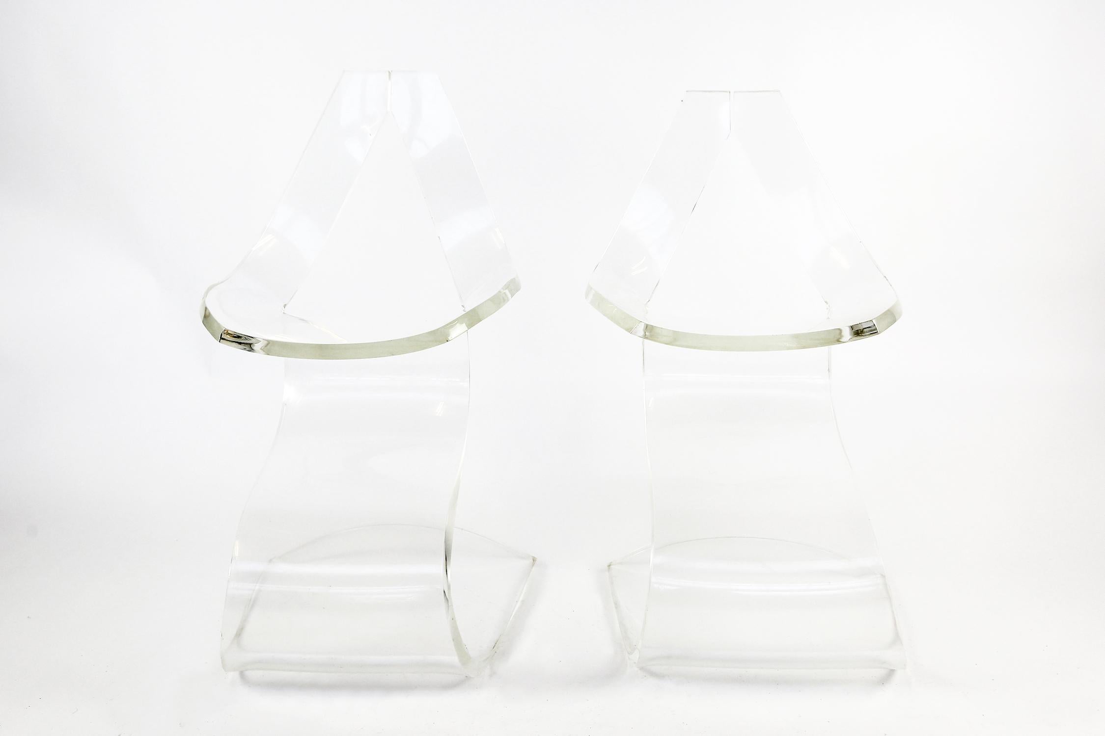 Pair of Lucite Michel Dumas chairs, each 'Dumas' chair is cut from a single sheet of heavy 
