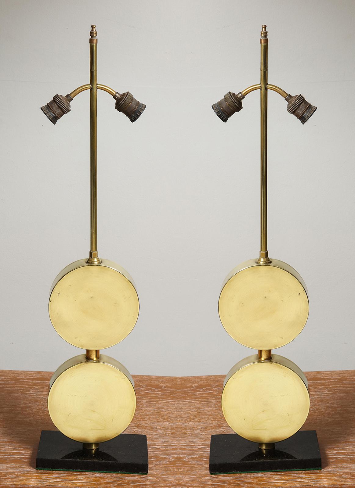 Pair of sculptural Mid-Century Modern brass disc lamps.