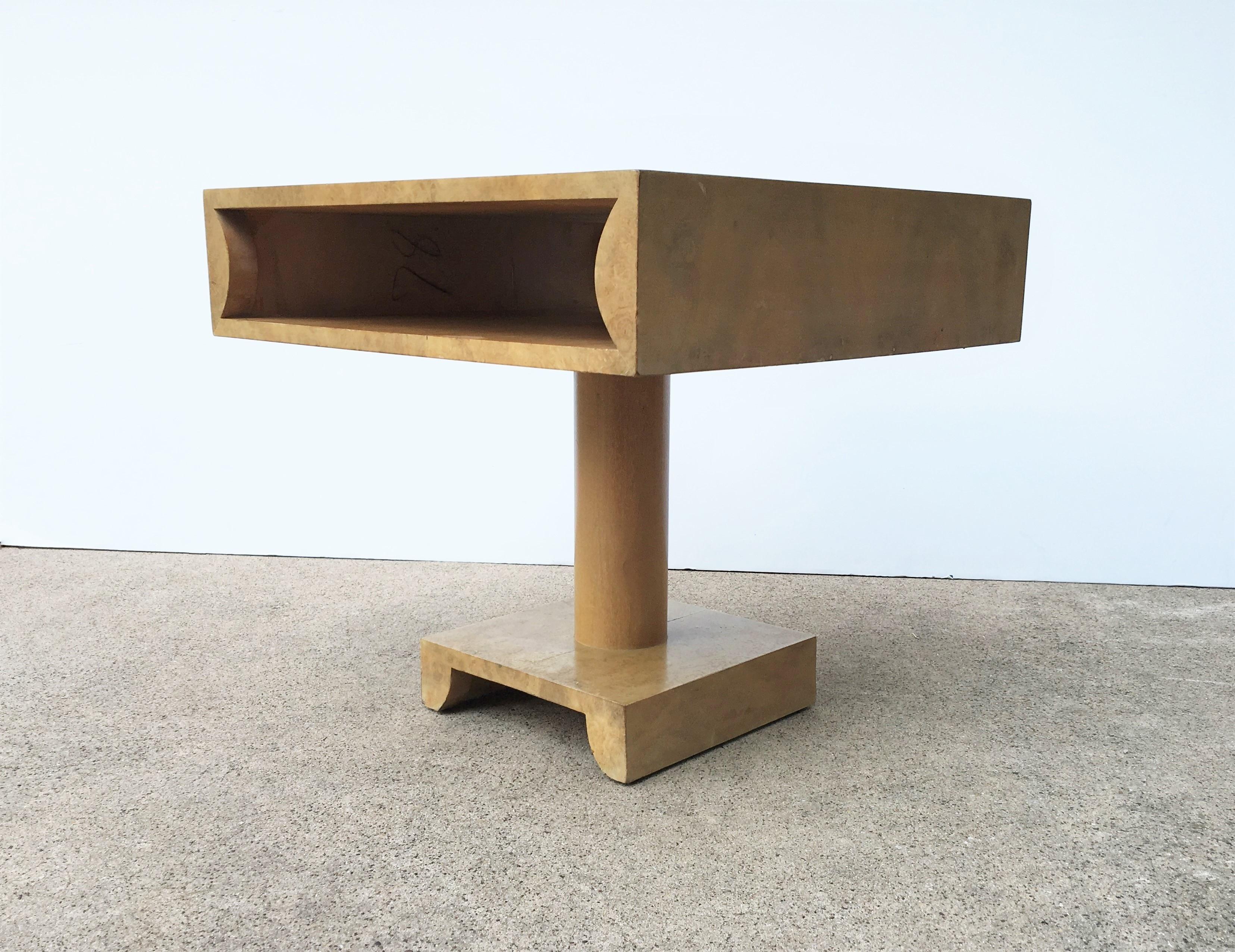 Pair of modernist nightstands or side tables, attributed to Tommi Parzinger. Unique open design top to place books or other essentials.
 