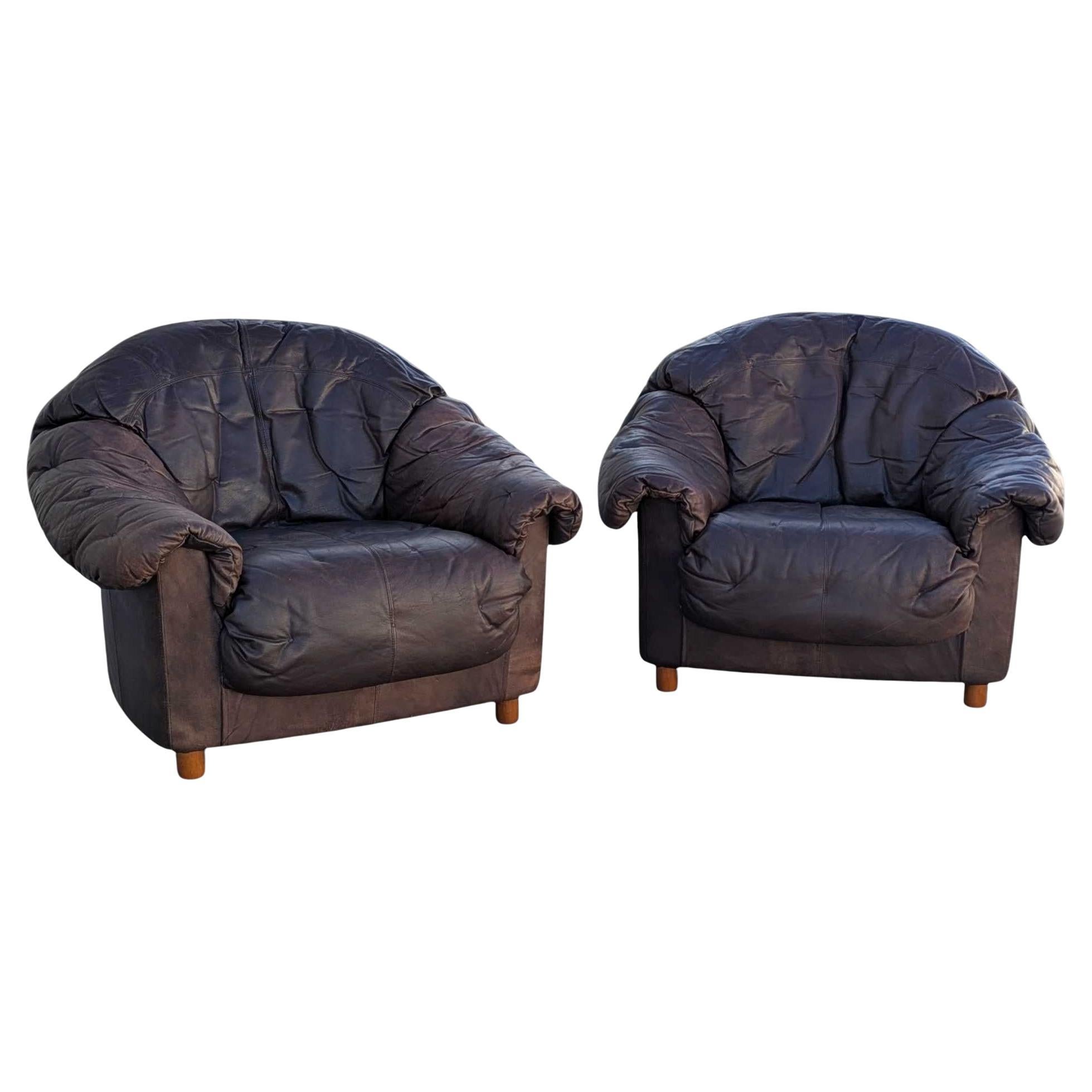 Pair of Distressed Brown Leather Club Lounge Chairs with Overstuffed Silhouette