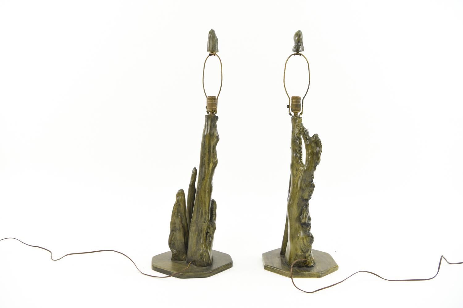 Mid-late 20th century, apparently unmarked. These lamps feature earthy green paint and original matching finials. They would make a unique, naturalistic addition to any decor!