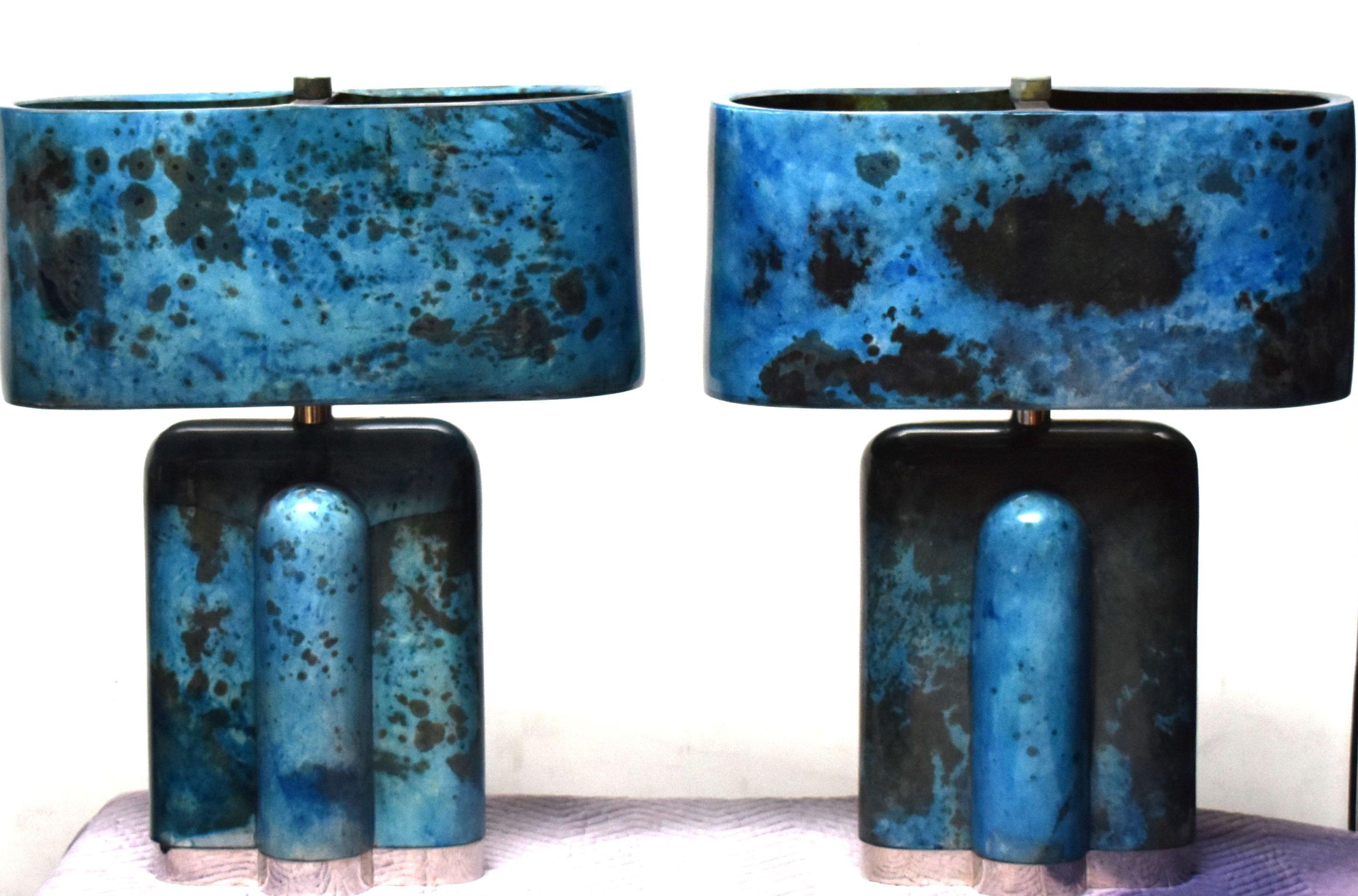 Pair of tall table lamps cover goatskin with chrome base and parchment molded shade. (Single socket). Parchment is in varying shades of dark and light blue color. (High gloss polyester resin filled finish).

Additional dimensions of lamp without