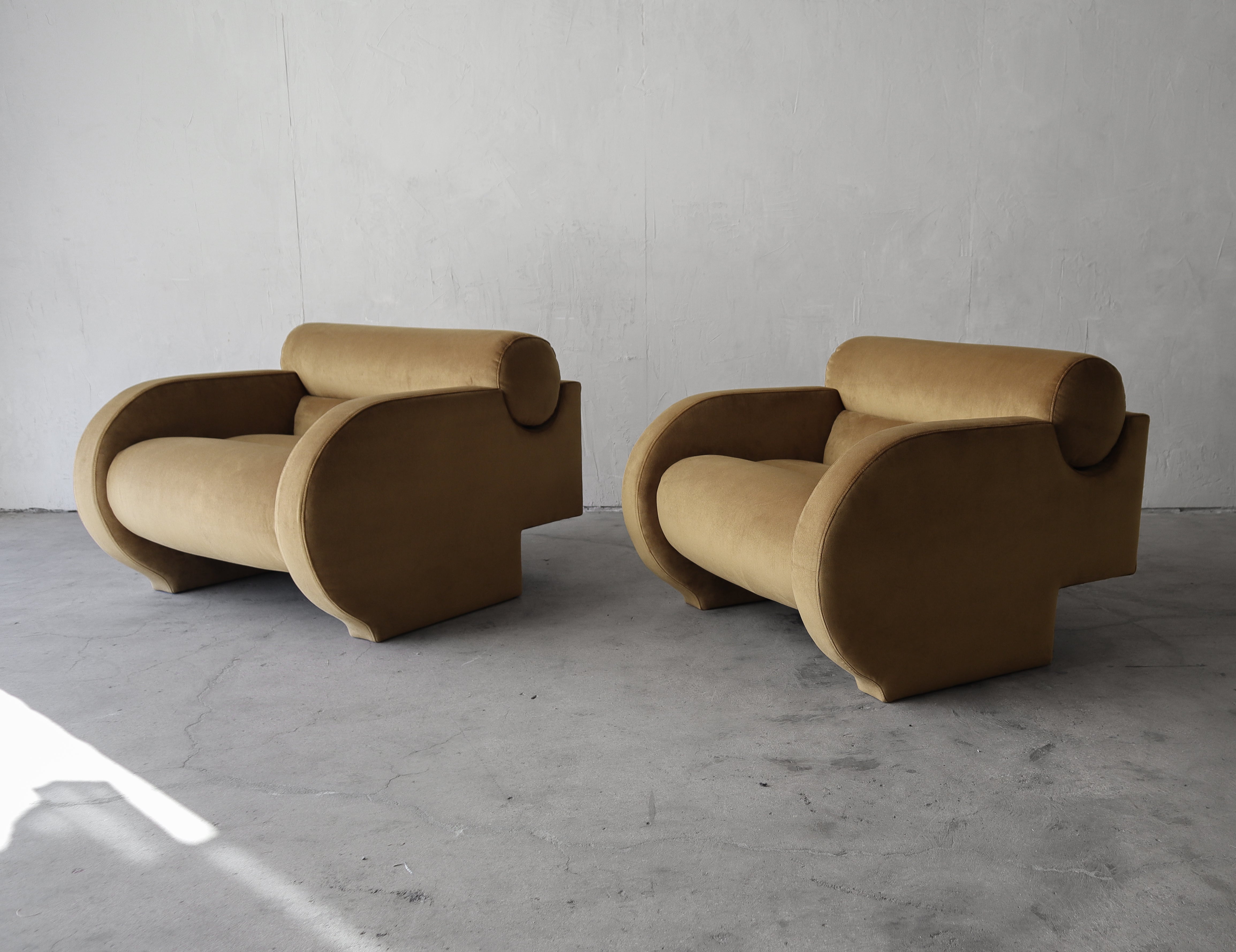 Iconic Vladimir Kagan for Directional lounge chairs as seen on Page 147 of Vladimir Kagan: A Lifetime of Avant-Garde.  

These chairs are RARE and incredible.  I don't think I've seen a more uniquely designed pair of lounge chairs.  The chair is